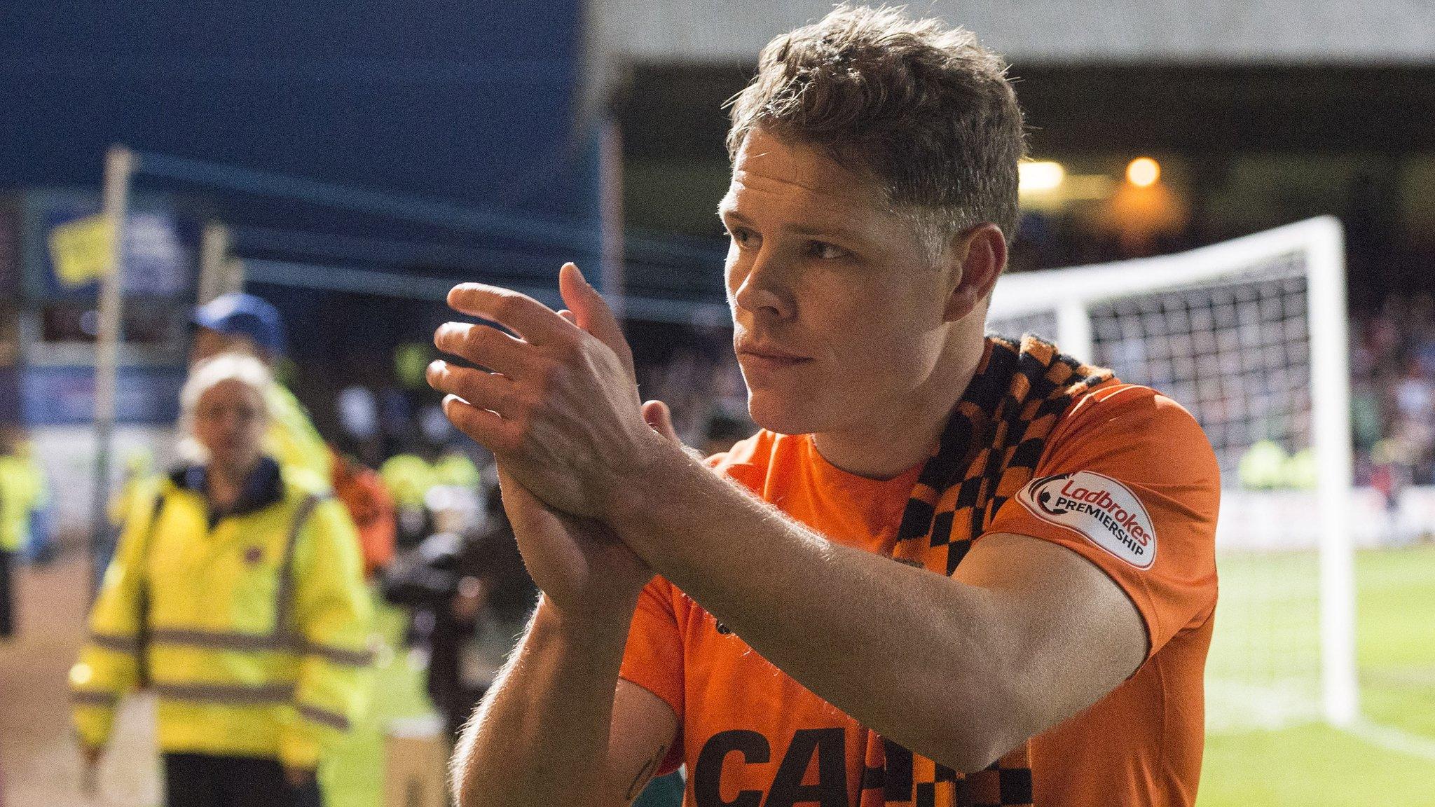 John Rankin applauds Dundee United fans after their relegation is confirmed