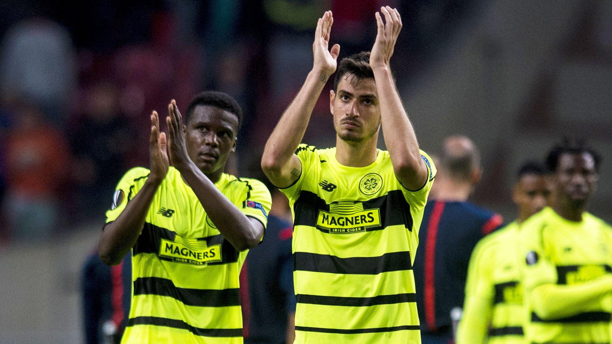 Celtic players applauding their fans