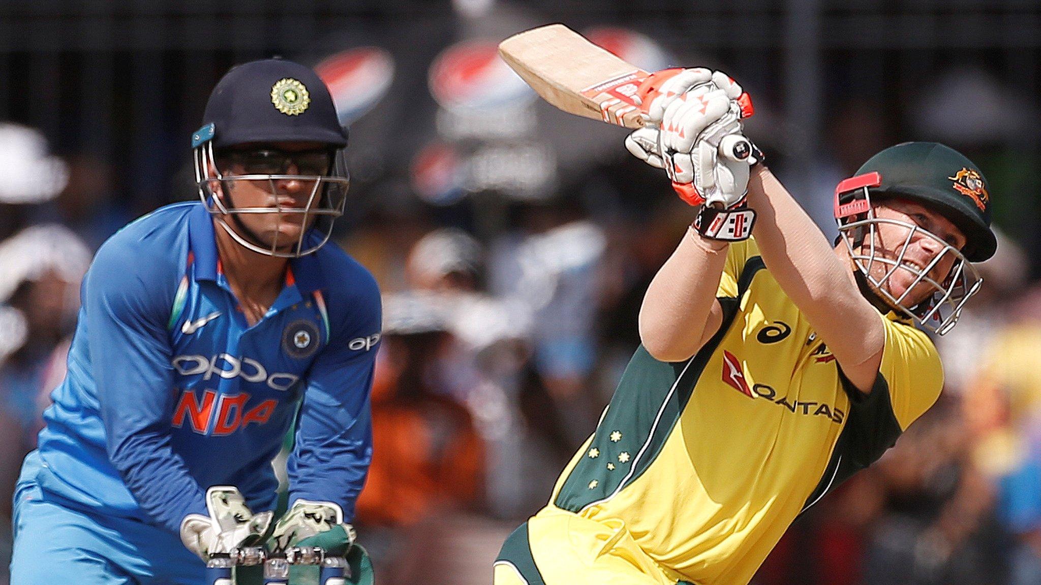 India's MS Dhoni and Australia's David Warner