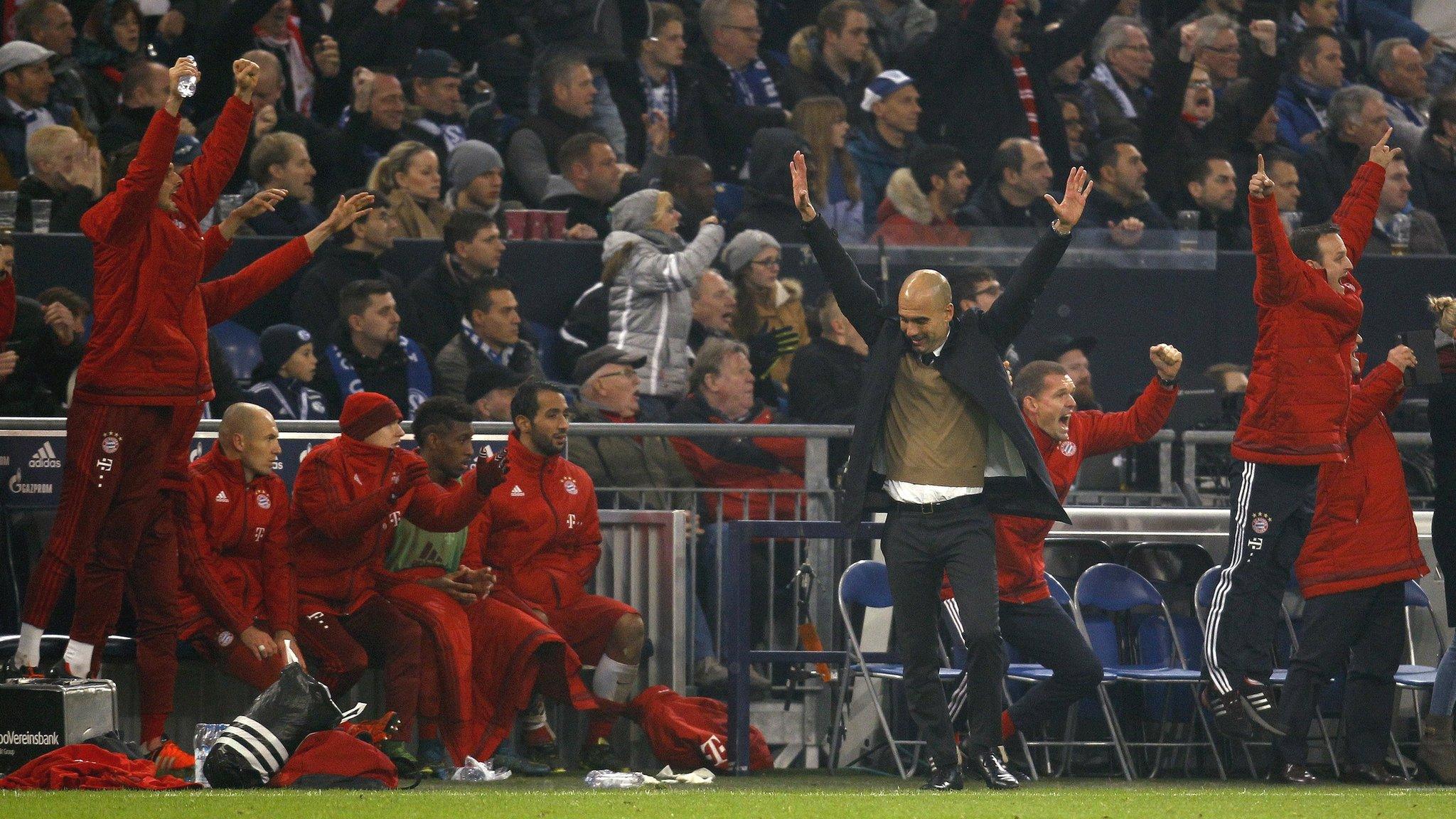 Bayern Munich"s coach Pep Guardiola celebrates a goal against Schalke