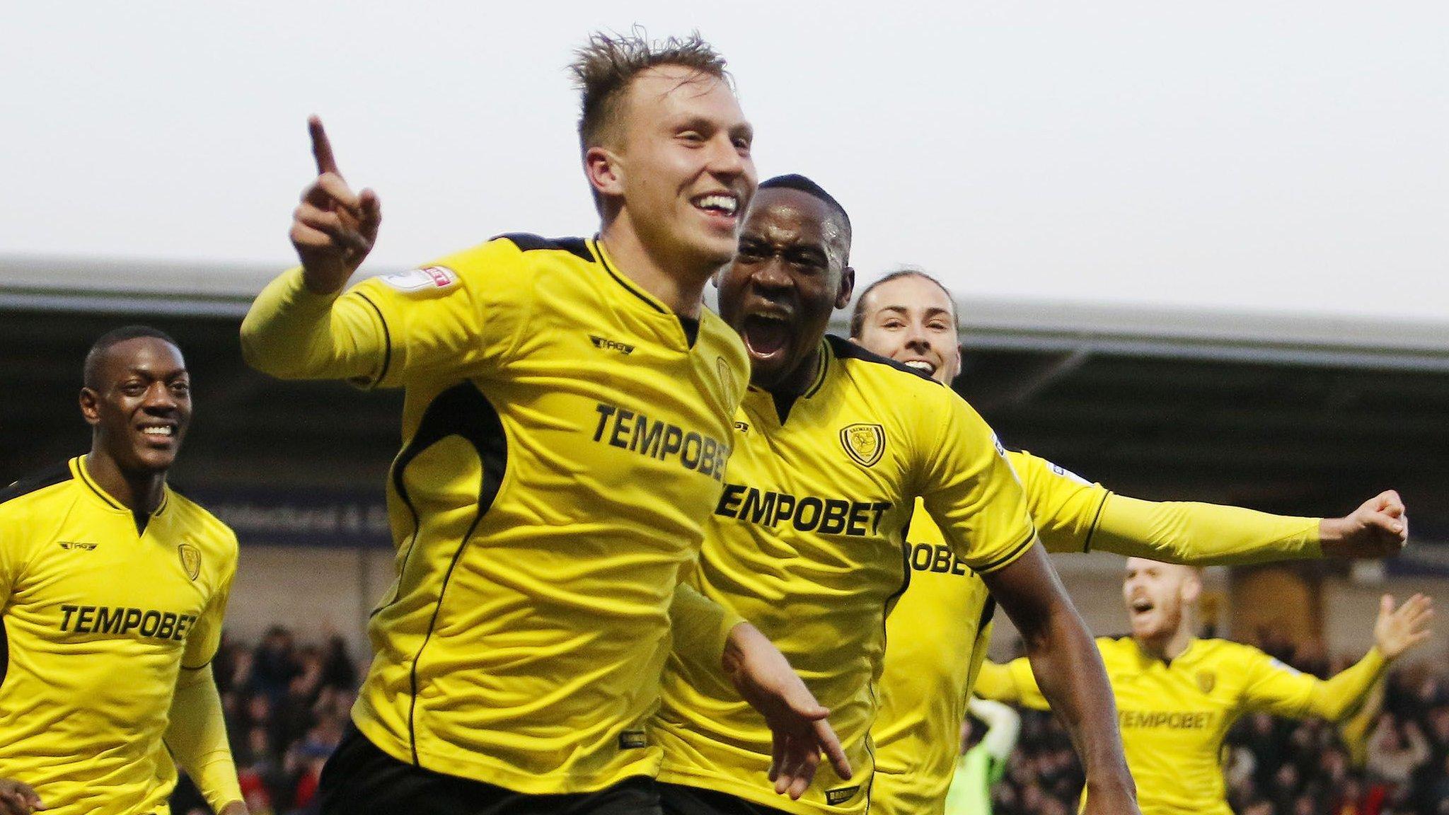 Cauley Woodrow celebrates