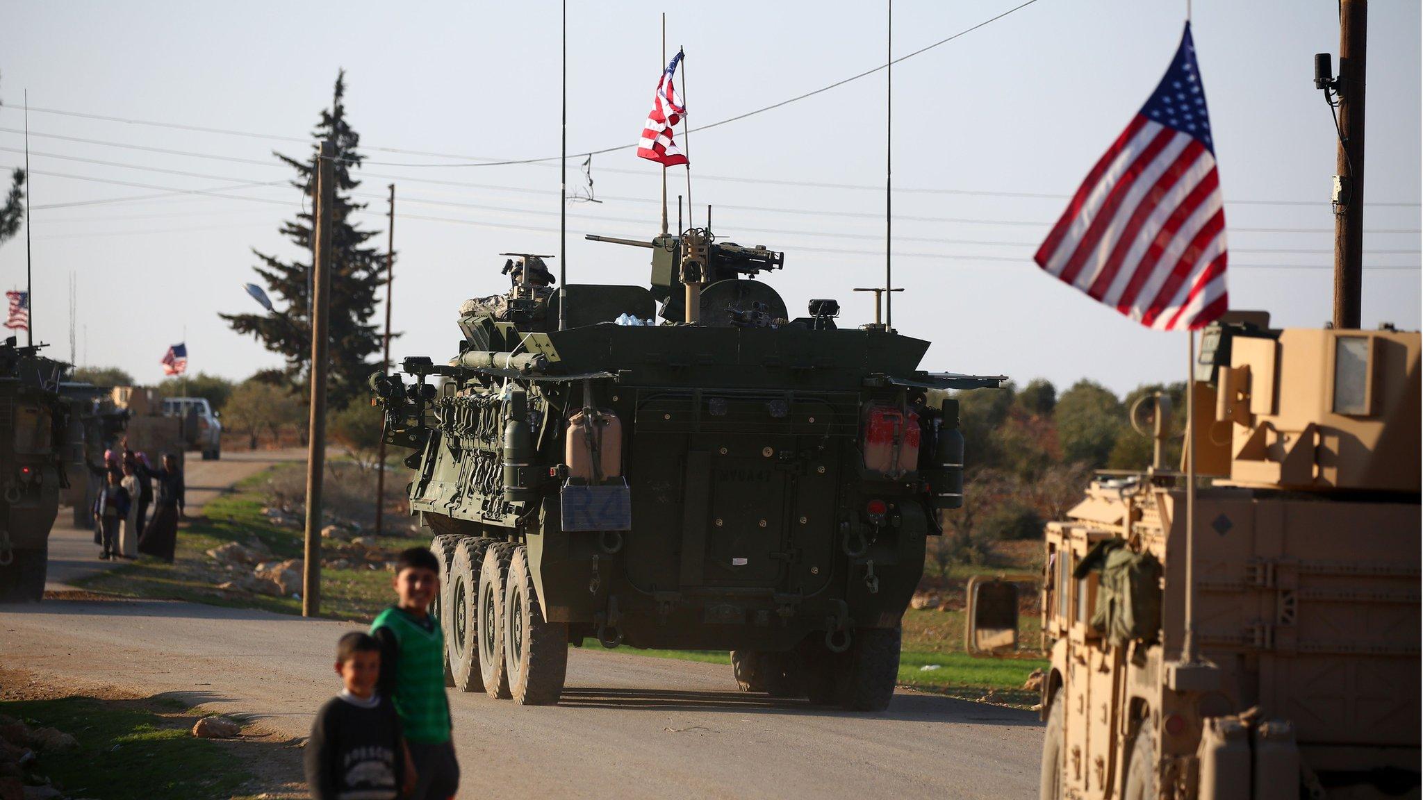 A convoy of US armoured vehicles drives near the village of Yalanli, on the western outskirts of the northern Syrian city of Manbij. March 5, 2017