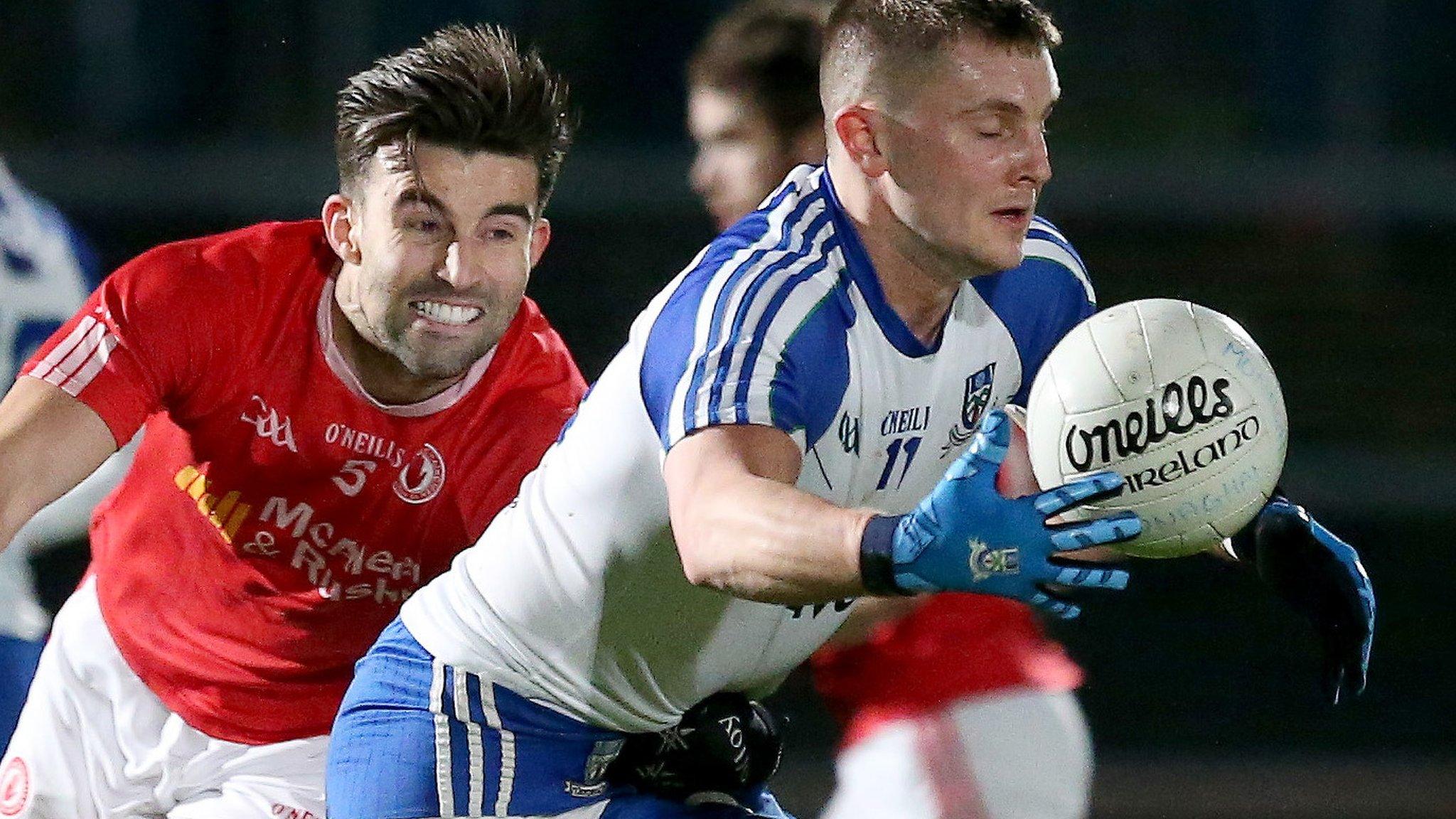 Tyrone defender Tiernan McCann tackles Monaghan's Dermot Malone