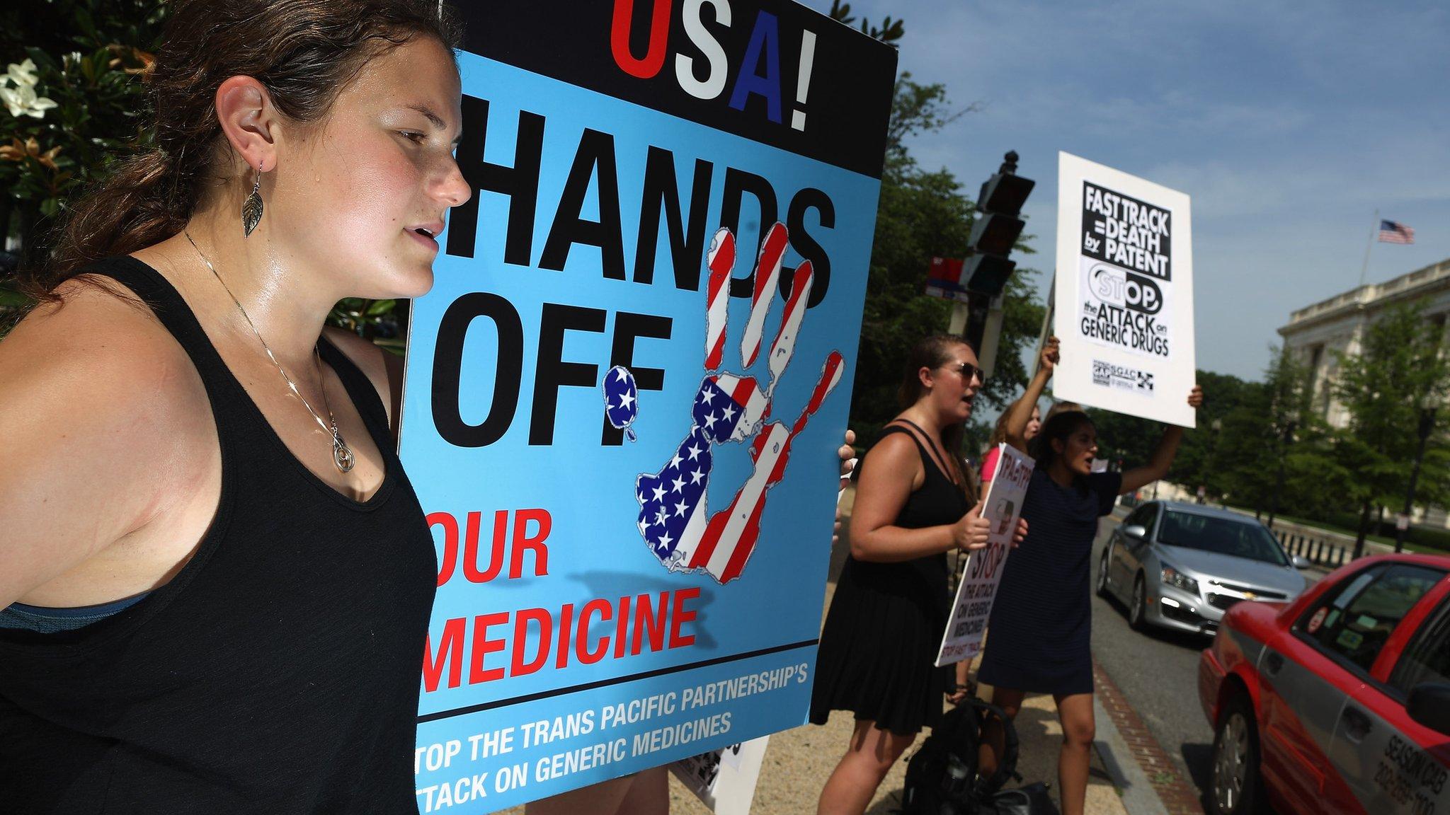 Demonstrators protest against the TPP trade agreement outside the Senate office buildings on Capitol Hill