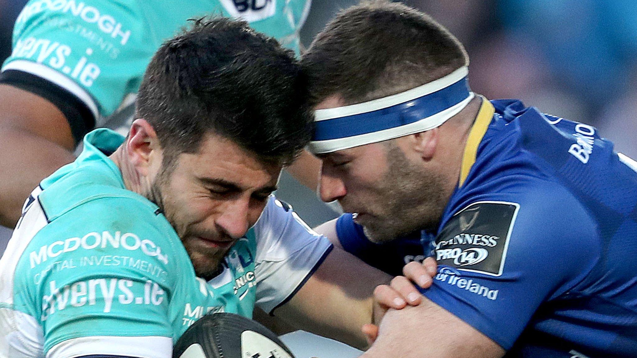 Connacht's Tiernan O'Halloran is tackled by Fergus McFadden of Leinster