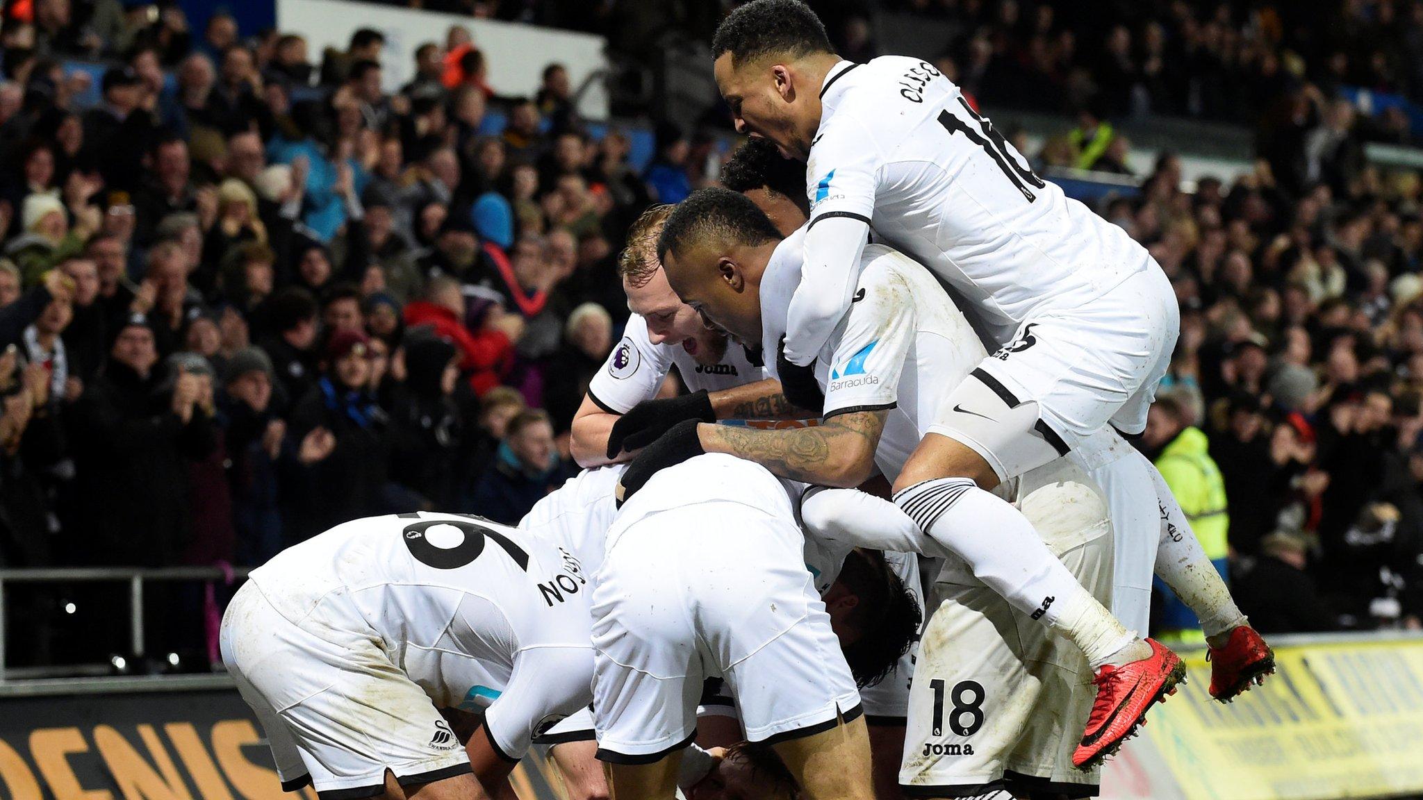 Swansea City celebrate third goal