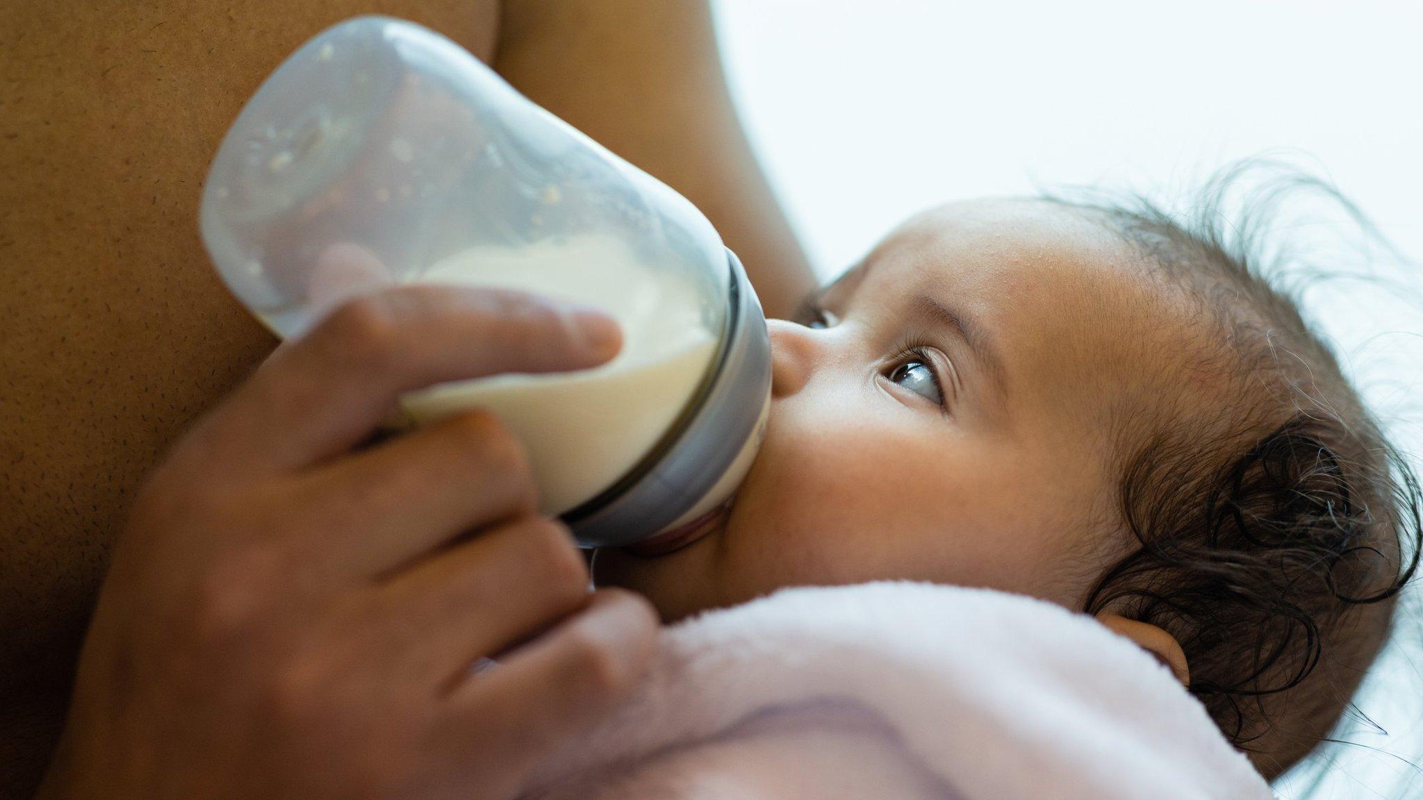 Baby drinking from bottle