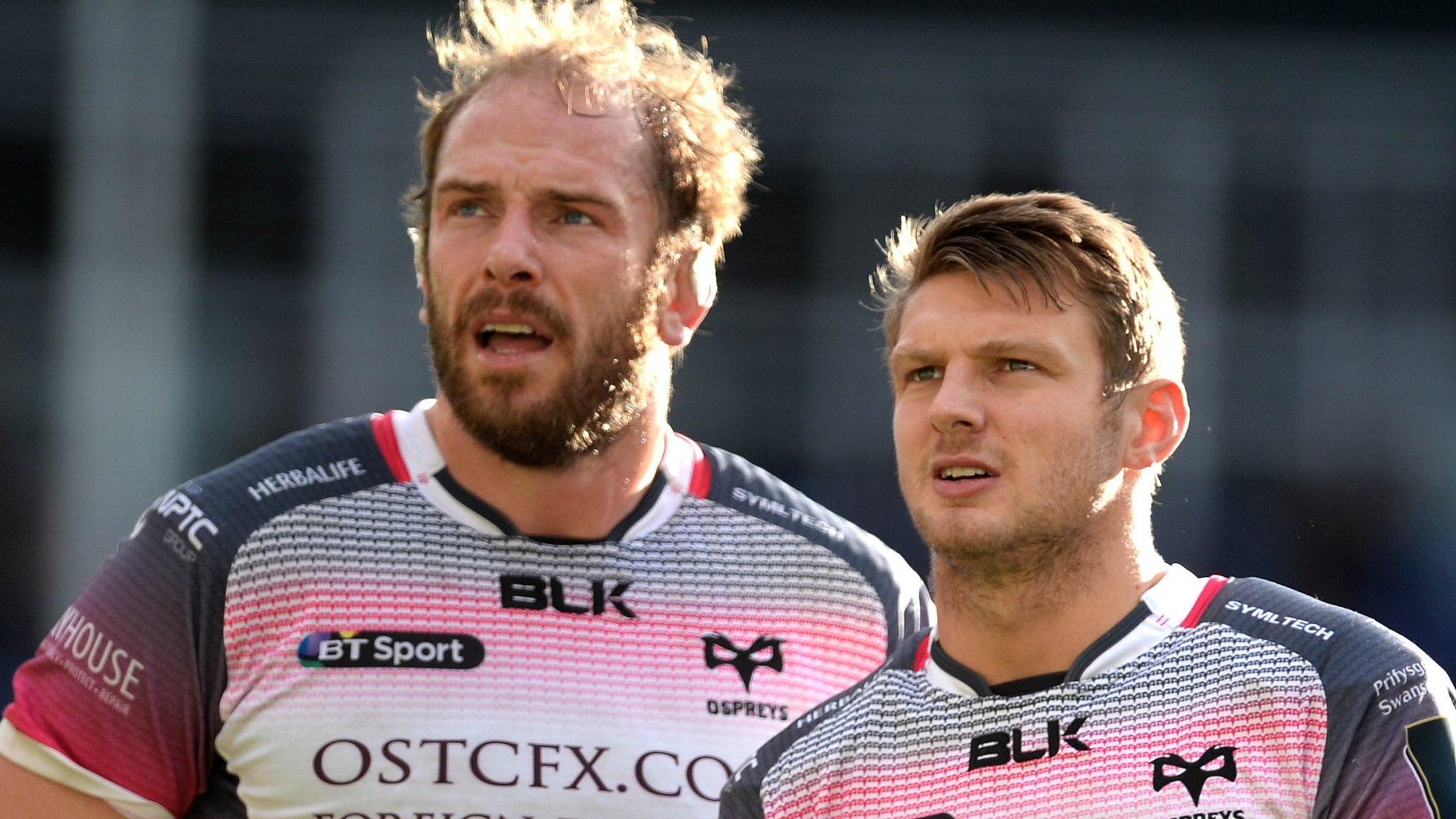 Alun Wyn Jones and Dan Biggar look on at a place kick