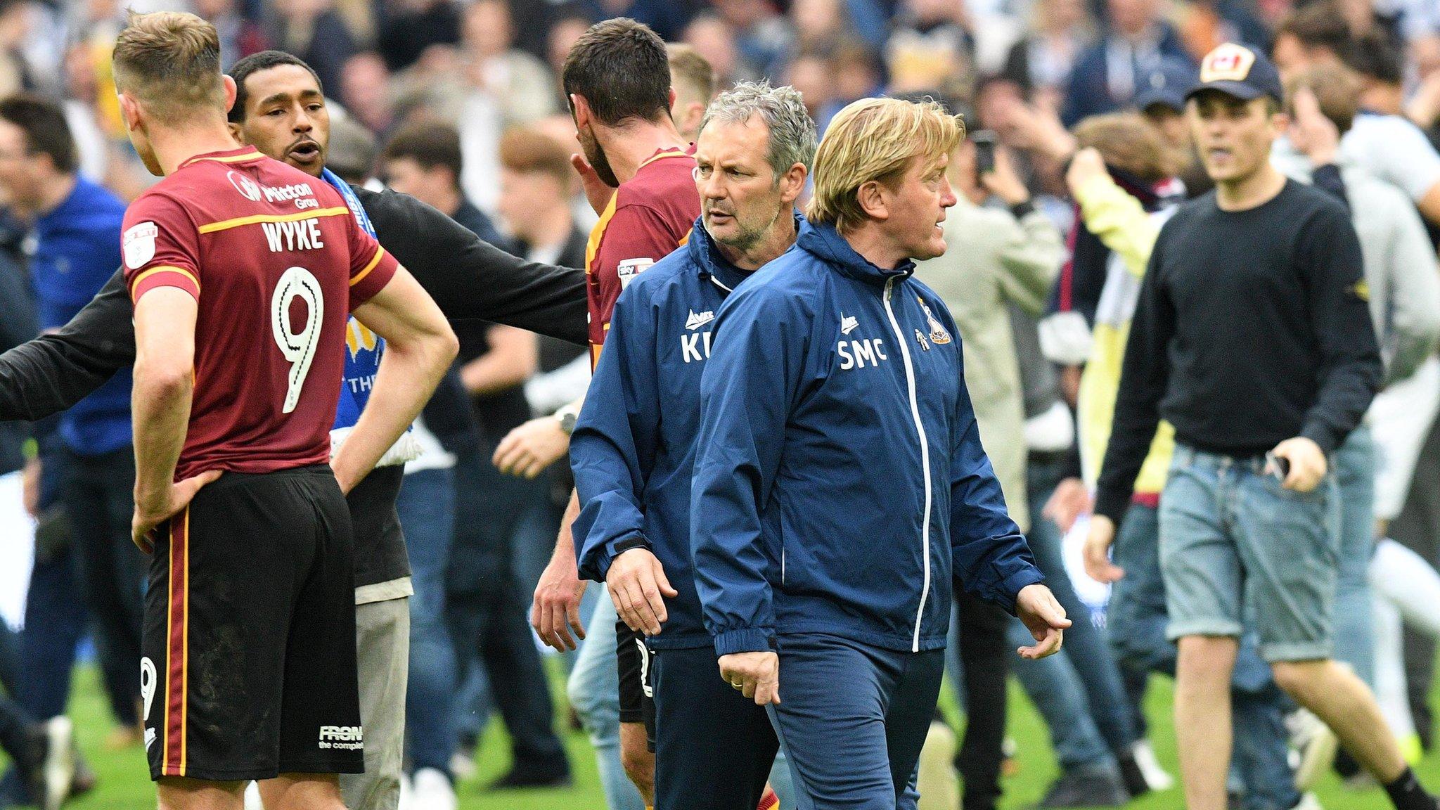 Stuart McCall with Millwall fans on the pitch