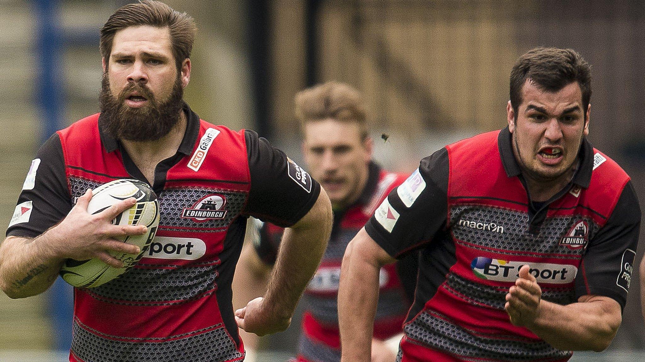 Cornell Du Preez runs with the ball for Edinburgh with Stuart McInally alongside him