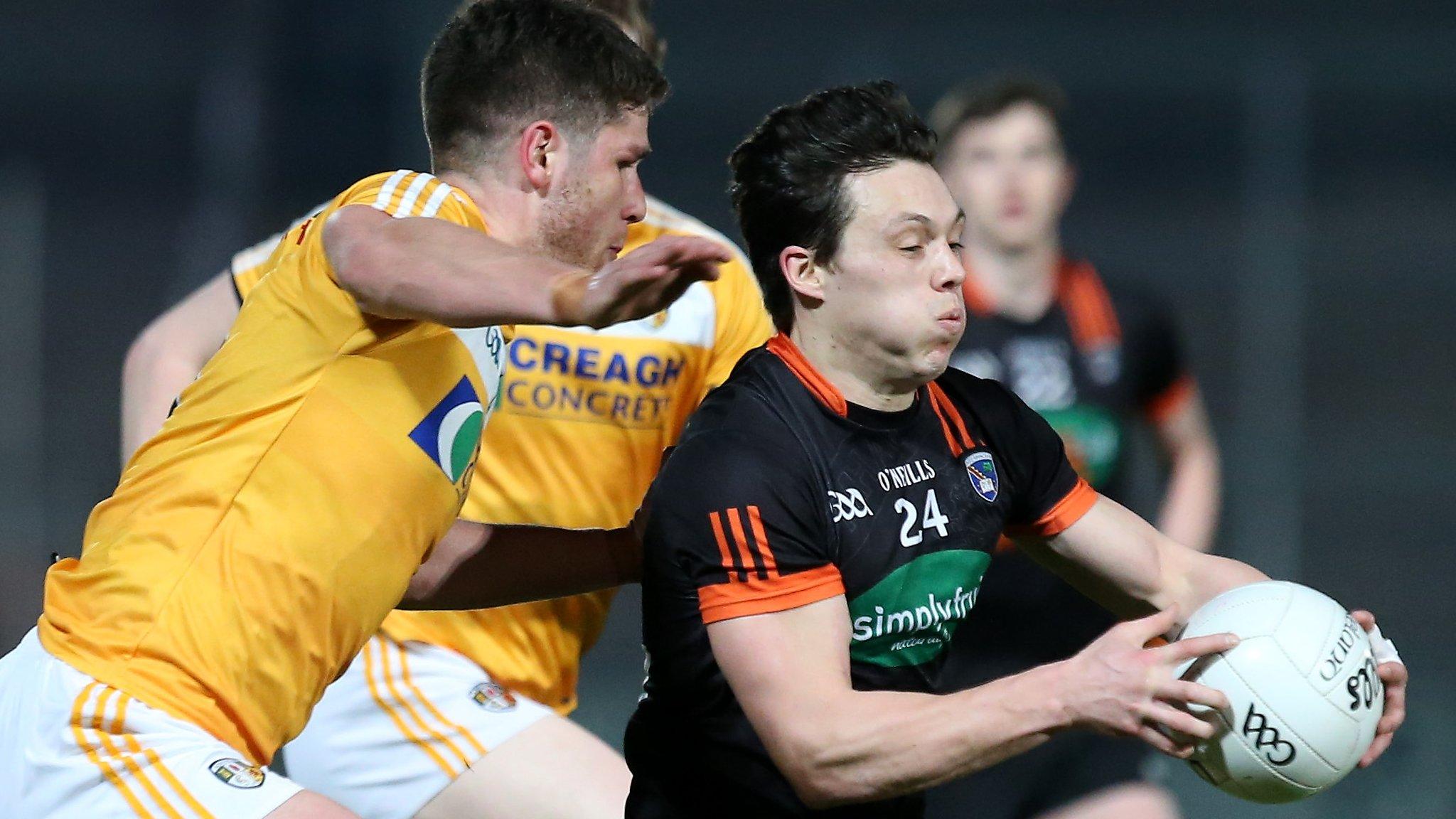 Antrim players attempt to close down Armagh's James Morgan