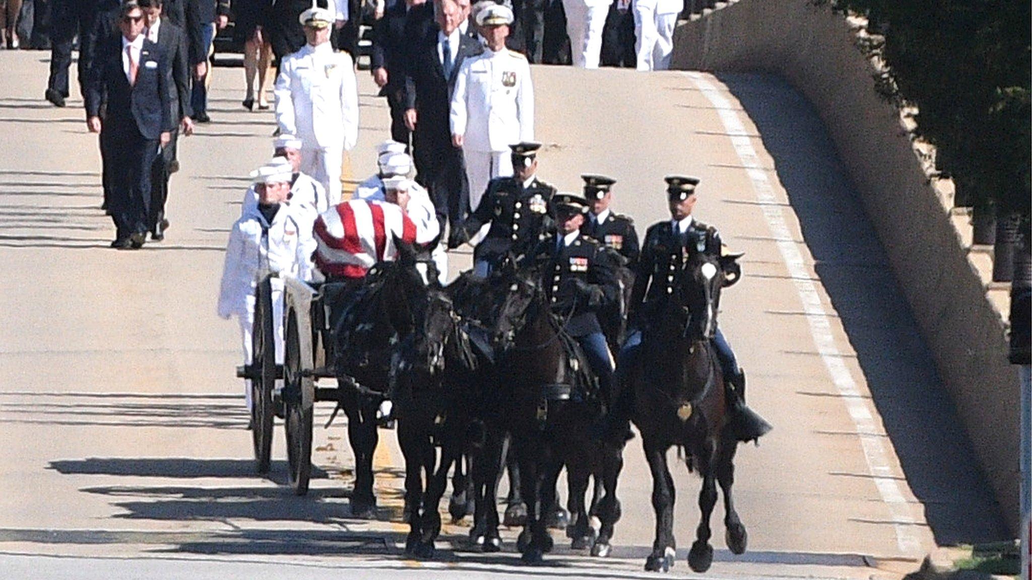 The funeral procession for the late US Senator John McCain heads to the cemetery for a private burial at the US Naval Academy in Annapolis, 2 September 2018