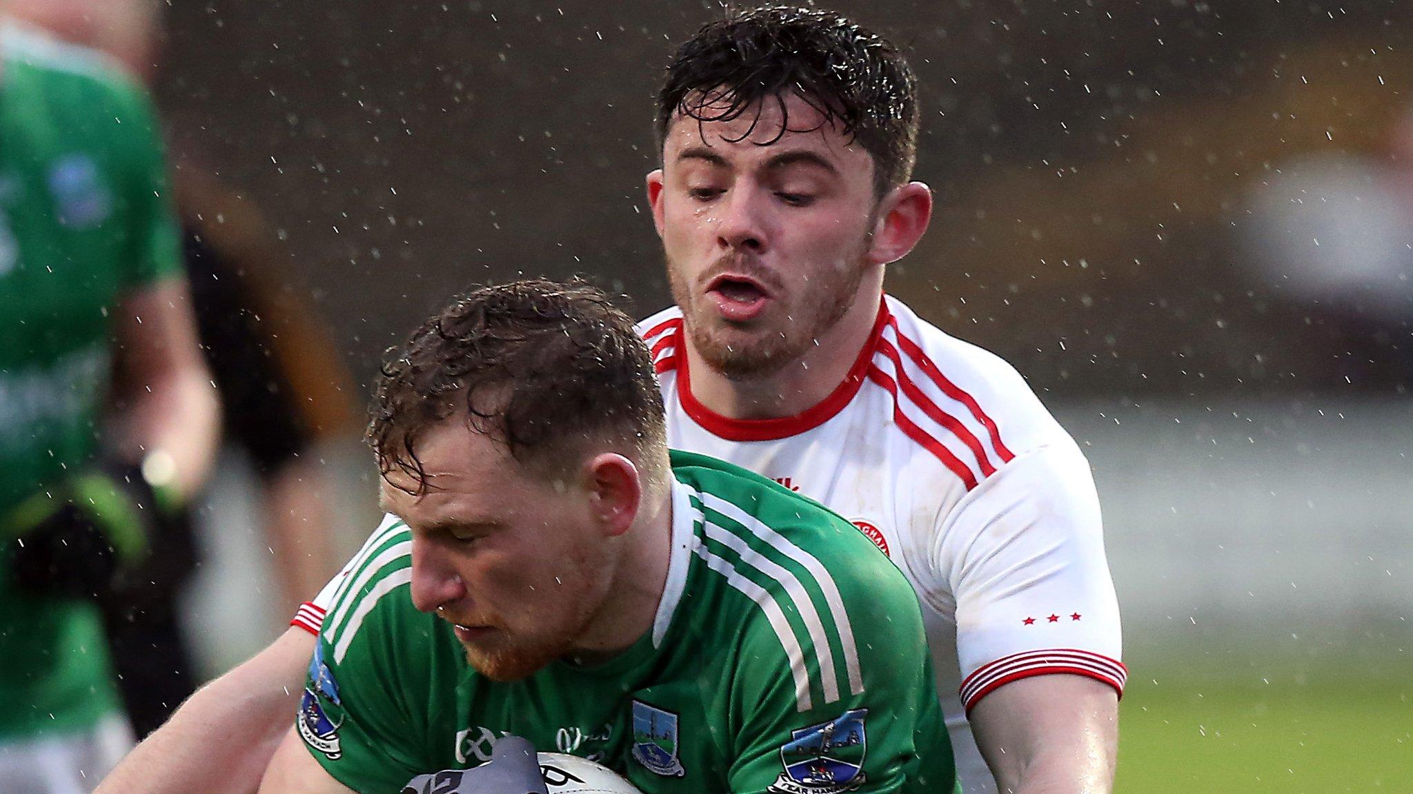 Fermanagh's Aidan Breen and Tyrone's Ciaran McLaughlin battle at Brewster Park