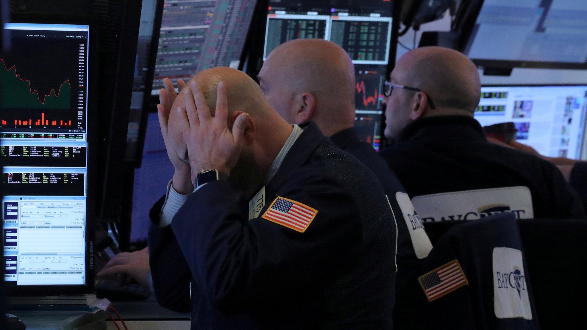 A trader works at his post on the floor of the New York Stock Exchange (NYSE) in New York, U.S., December 19, 2018.