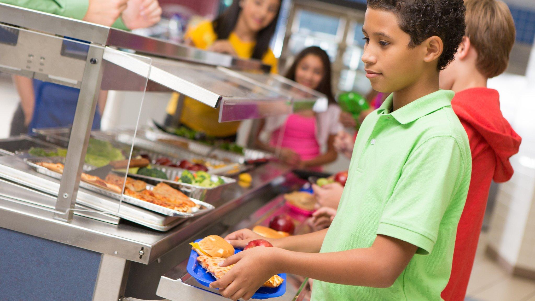 children getting school meals