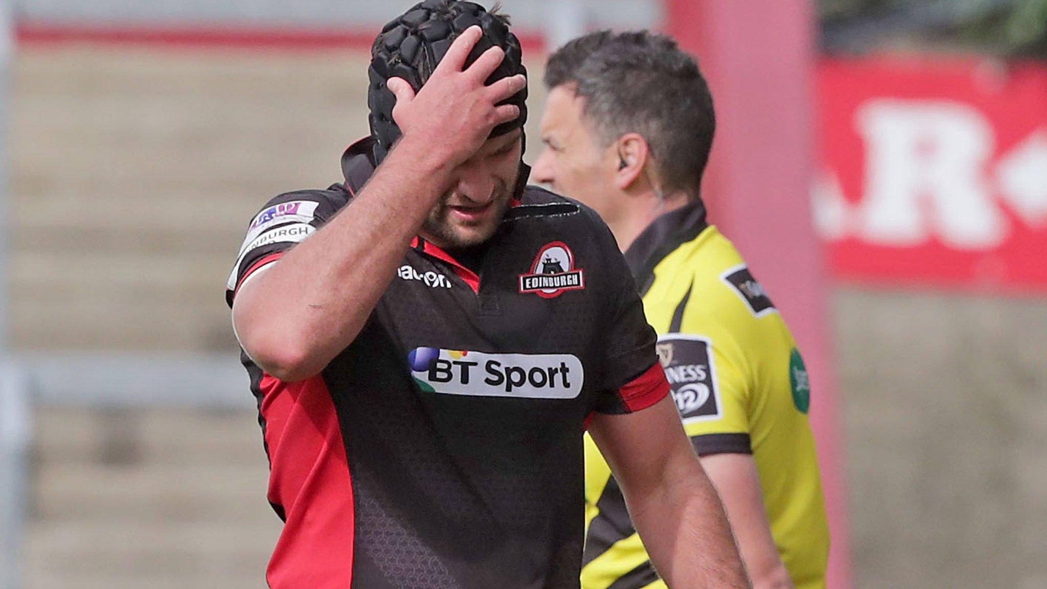 Fraser McKenzie holds his head after being sin-binned against Munster