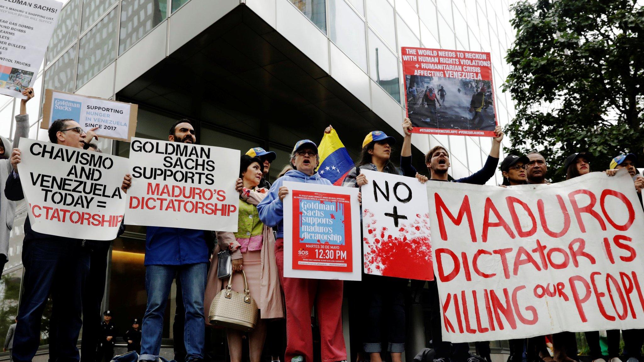 Protesters demonstrate outside Goldman Sachs headquarters in New York, May 30, 2017