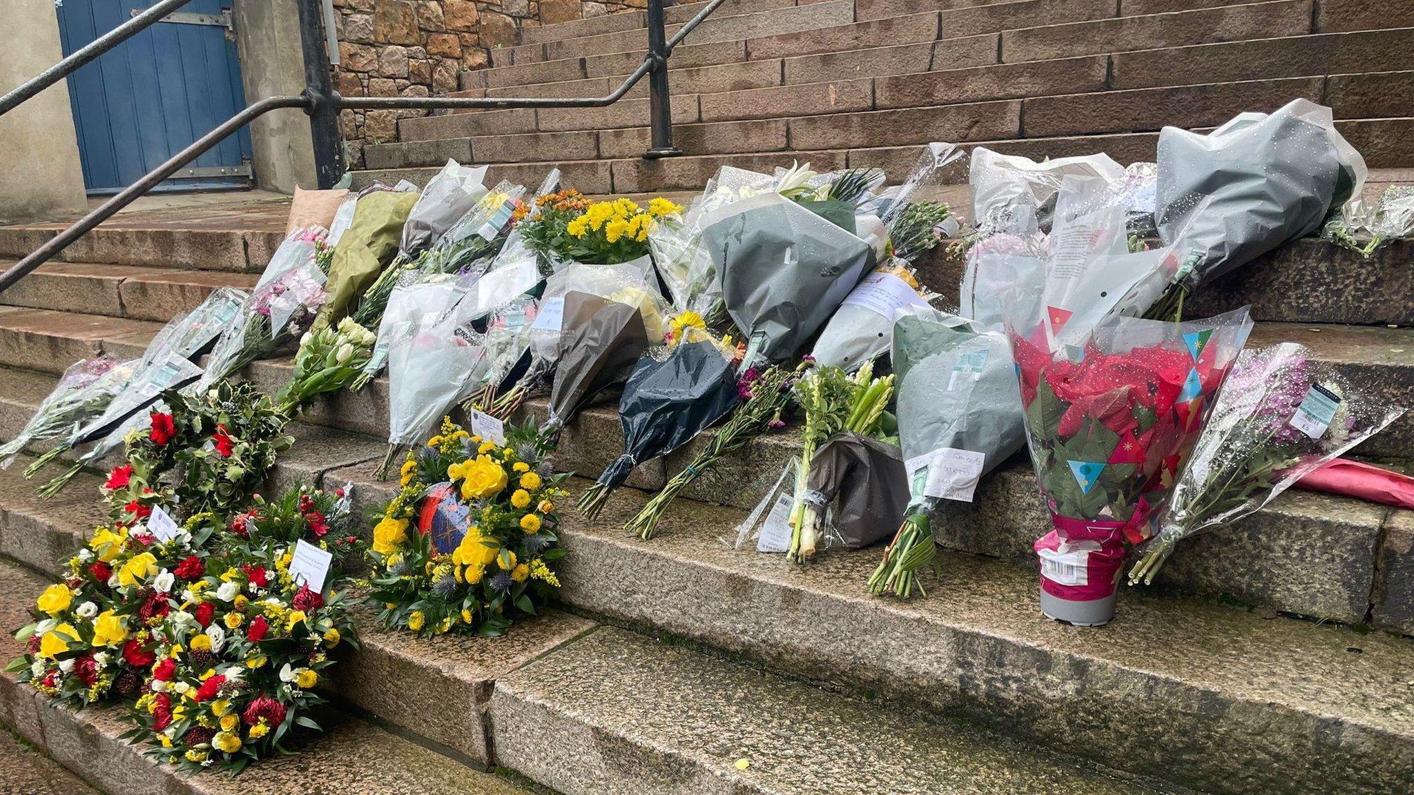 Memorial flowers on steps in St Helier