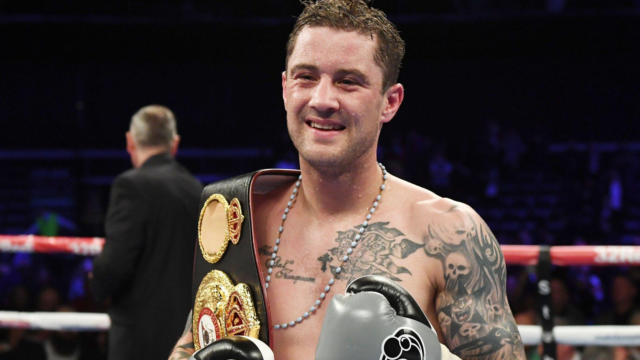 Ricky Burns clasps the WBA world super-lightweight belt