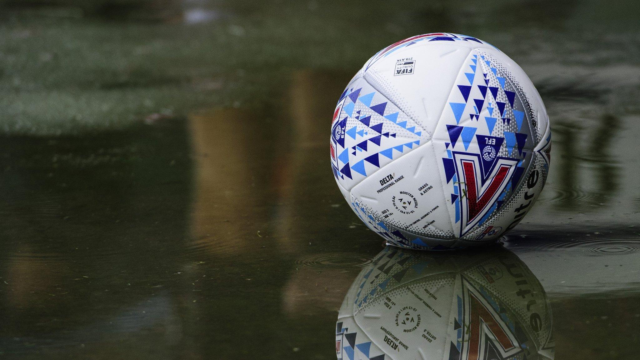 Football in a puddle