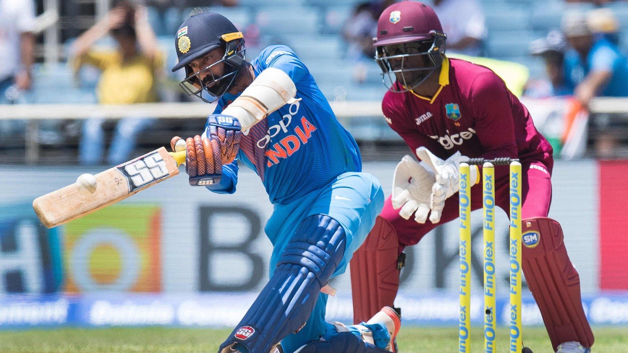 India's Dinesh Karthik and West Indies' Chadwick Walton