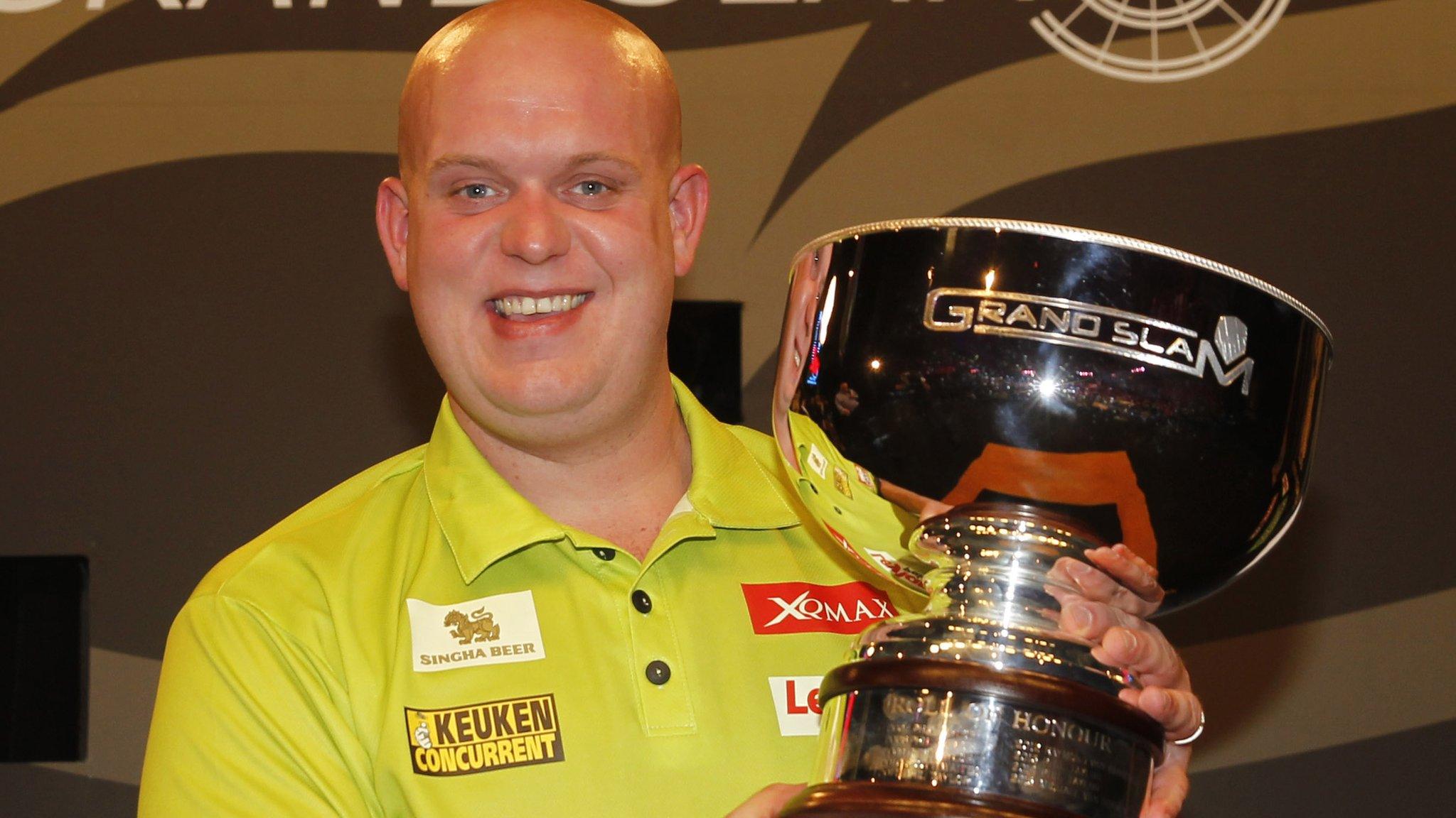 Michael van Gerwen with the Grand Slam or Darts trophy