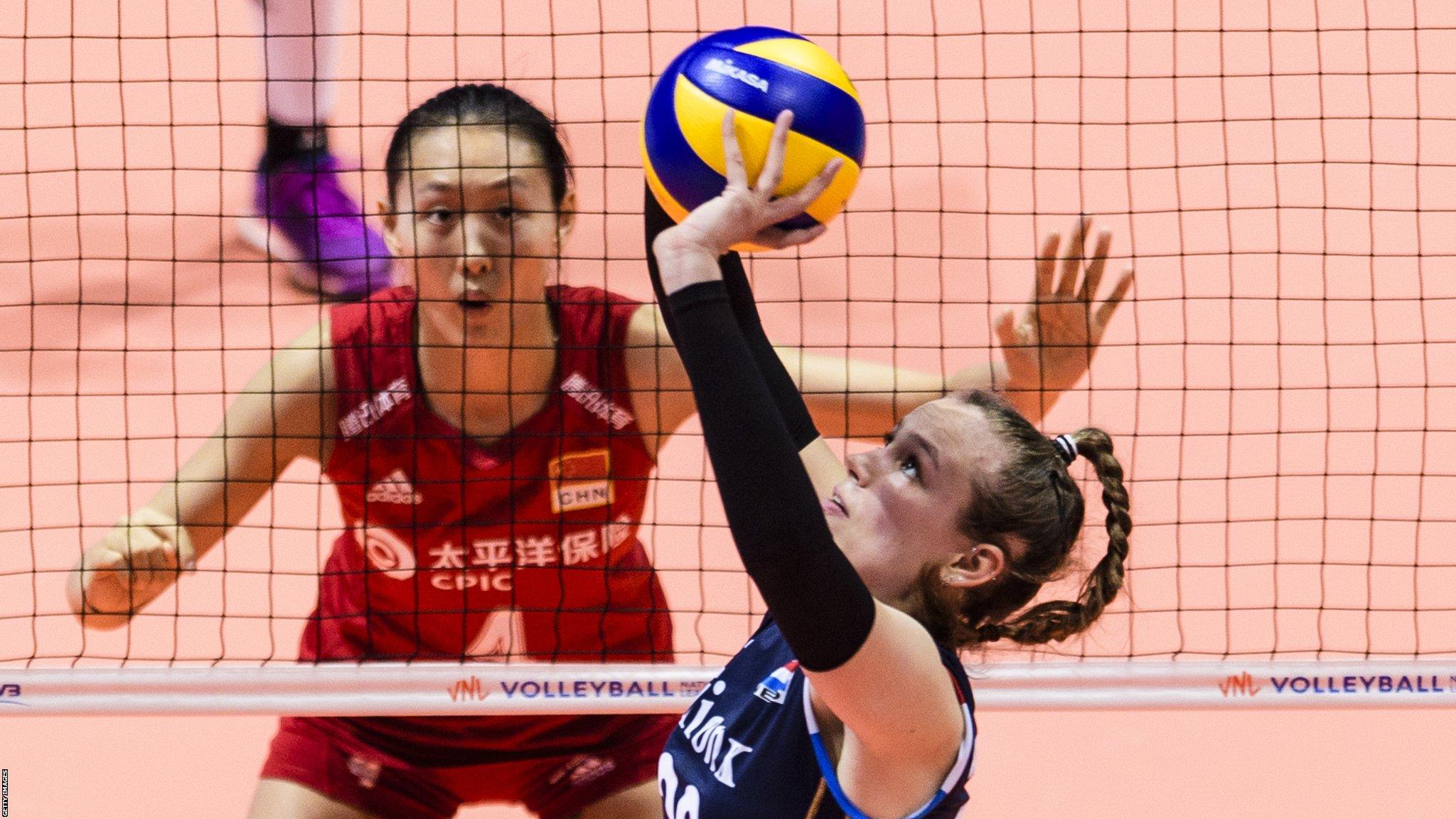 Hong Kong, Hong Kong, 5 June: Sarah van Aalen of Netherlands (R) passes the ball during the FIVB Women's Nation's League match between Netherlands and China at the Hong Kong Coliseum. (Photo by Marcio Machado/Getty Images)