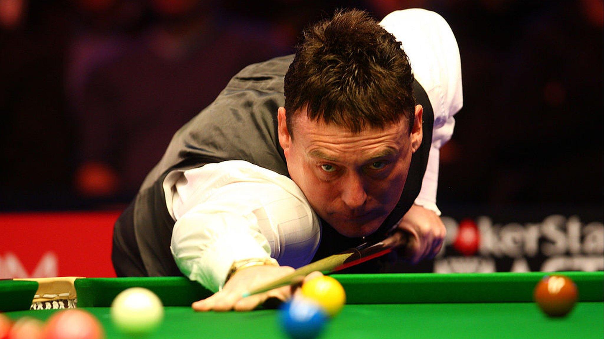 Jimmy White plays a shot