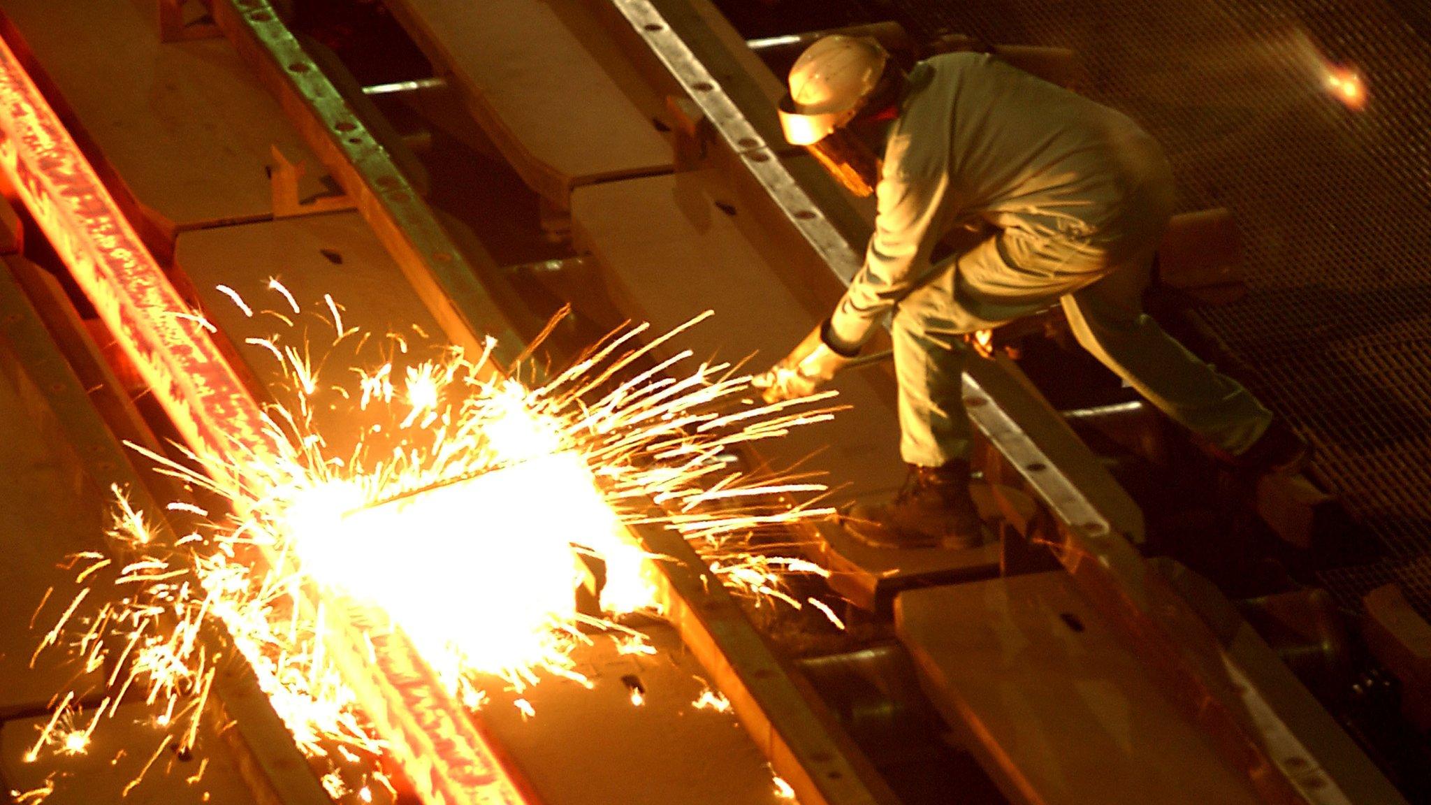 A worker at the Tamco steel mini mill in Rancho Cucamonga, California. October 4, 2002