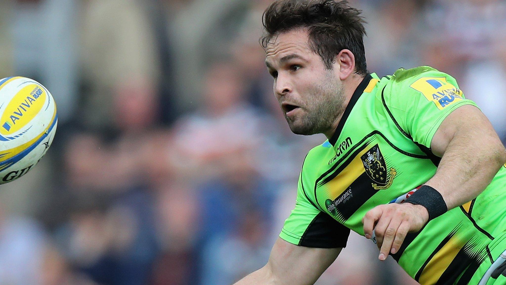 Cobus Reinach of Northampton off loads the ball during the Premiership match between Leicester Tiger