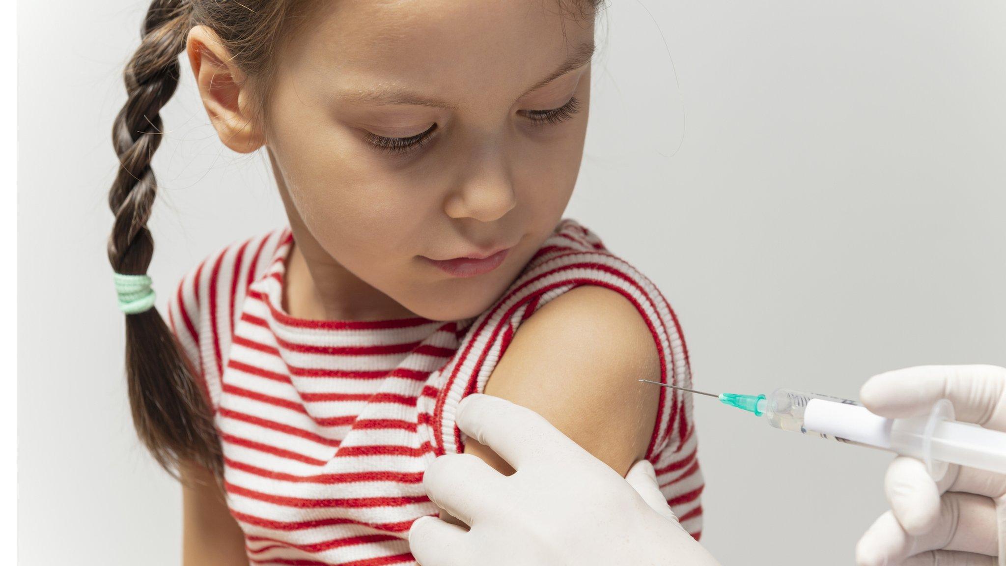 Girl getting vaccinated