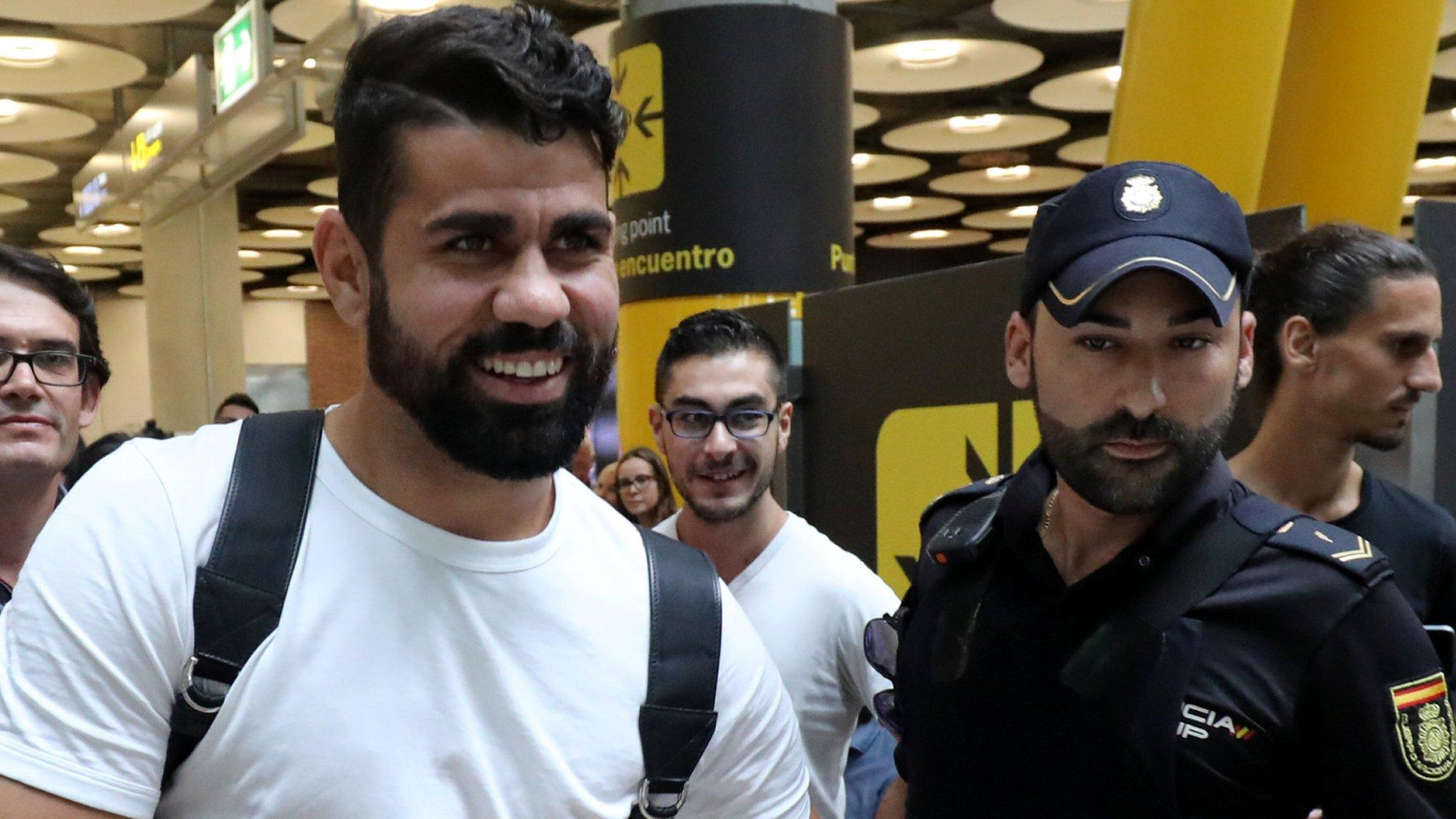 Diego Costa was given a police escort after landing in Madrid