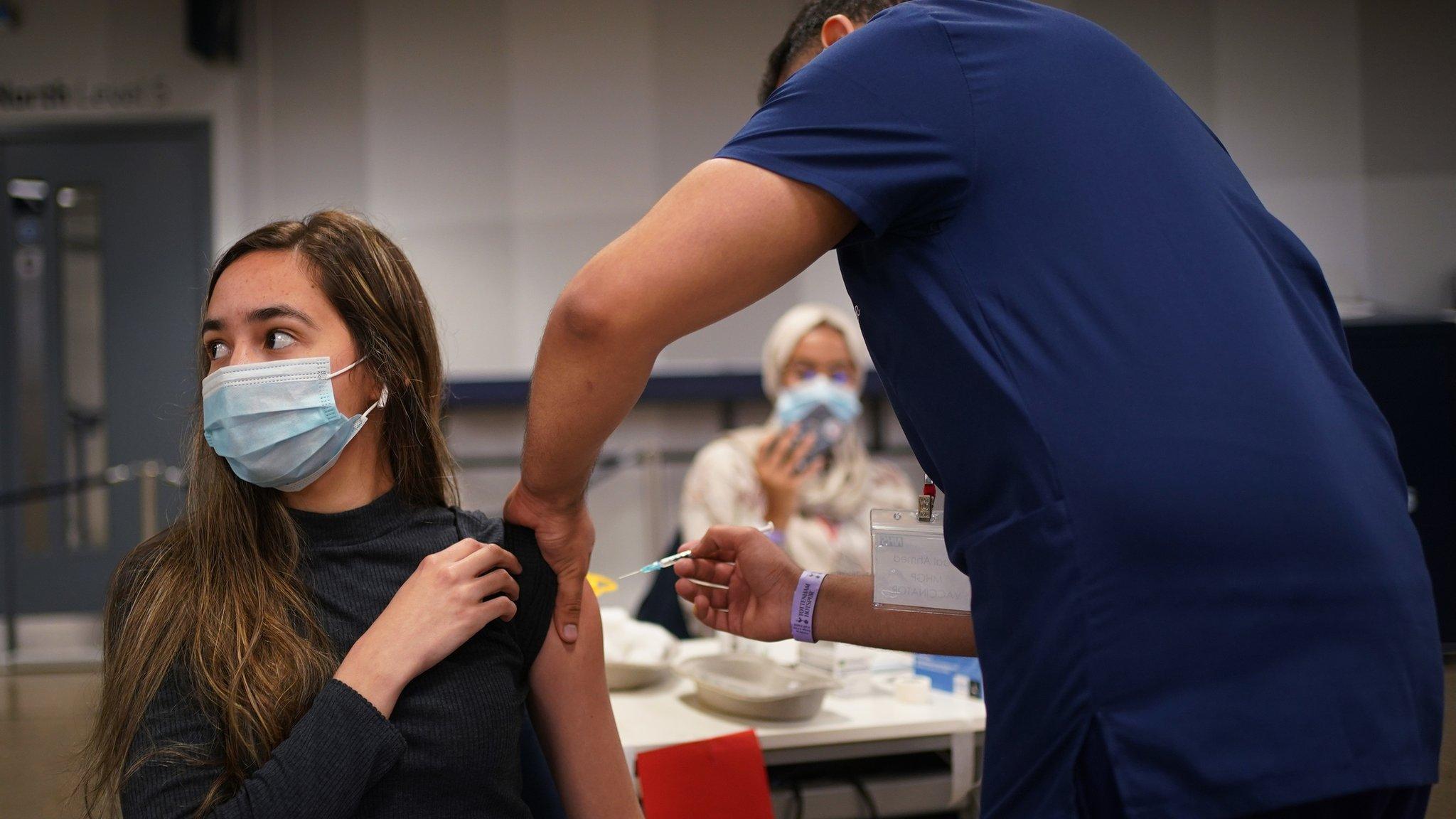 Woman receiving vaccination