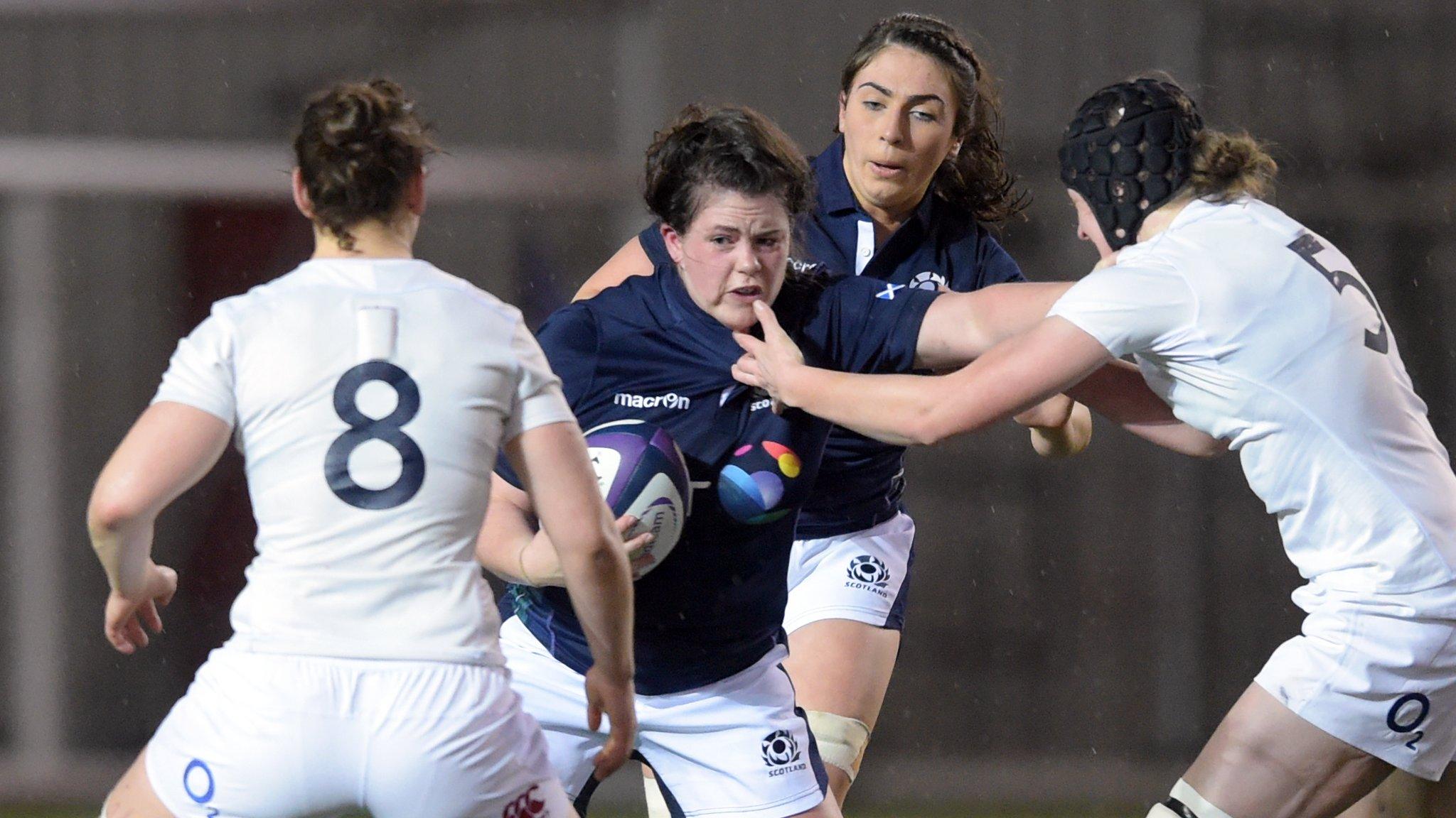 Scotland's Lindsay Smith (left) holds off Emily Braund