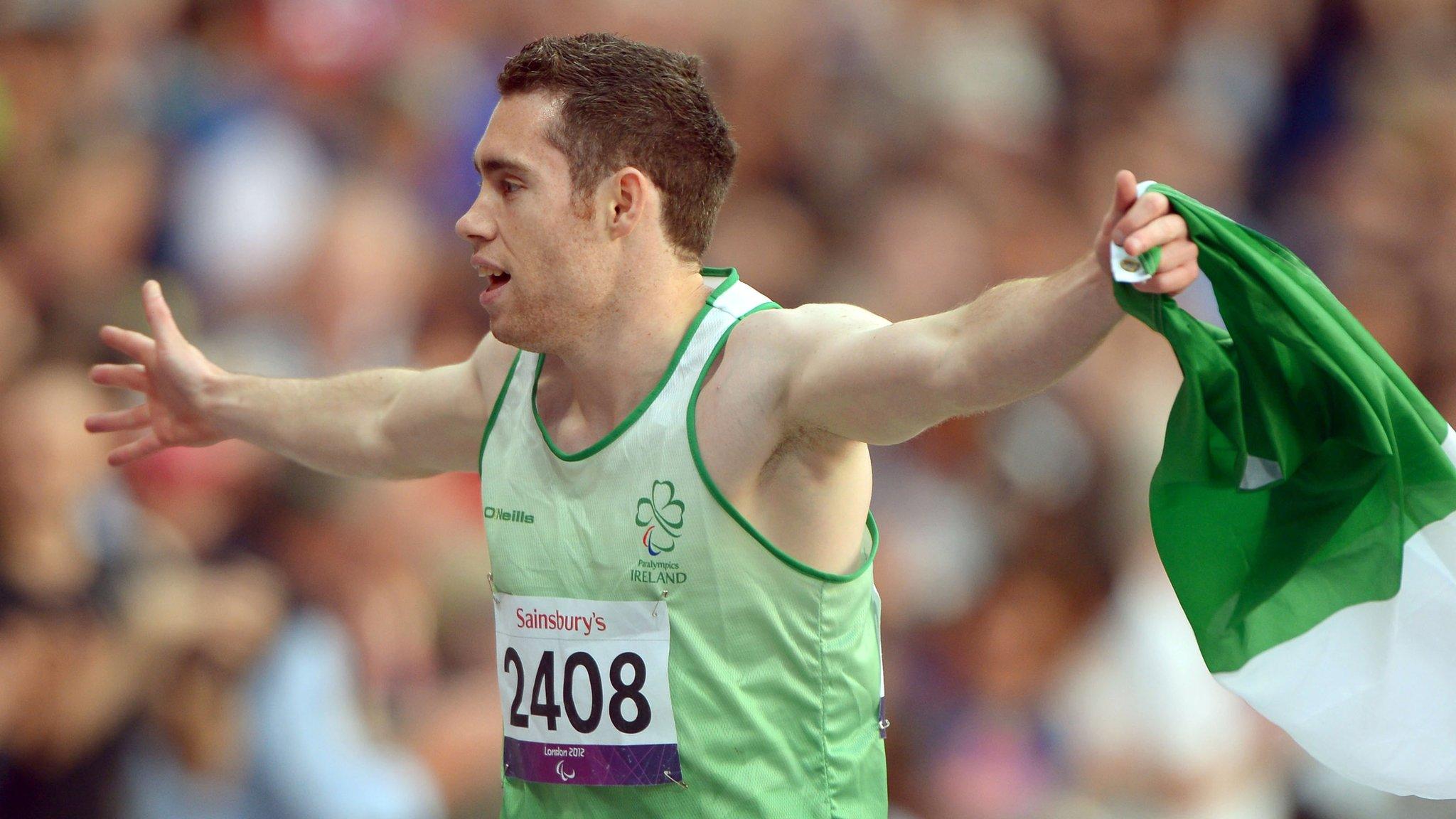 Jason Smyth celebrates after his T13 100m triumph in London