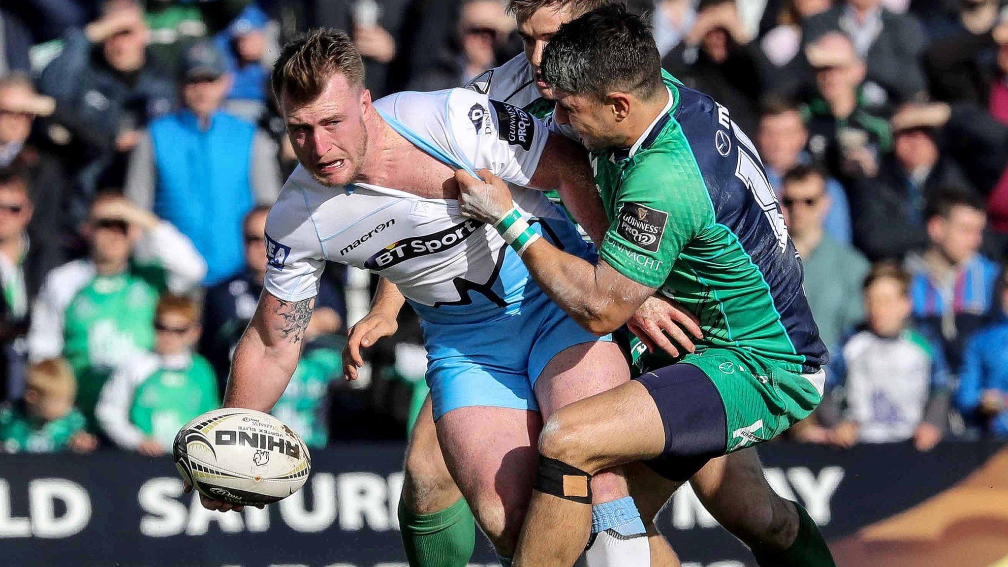 Glasgow full-back Stuart Hogg tries to offload out of a Connacht tackle