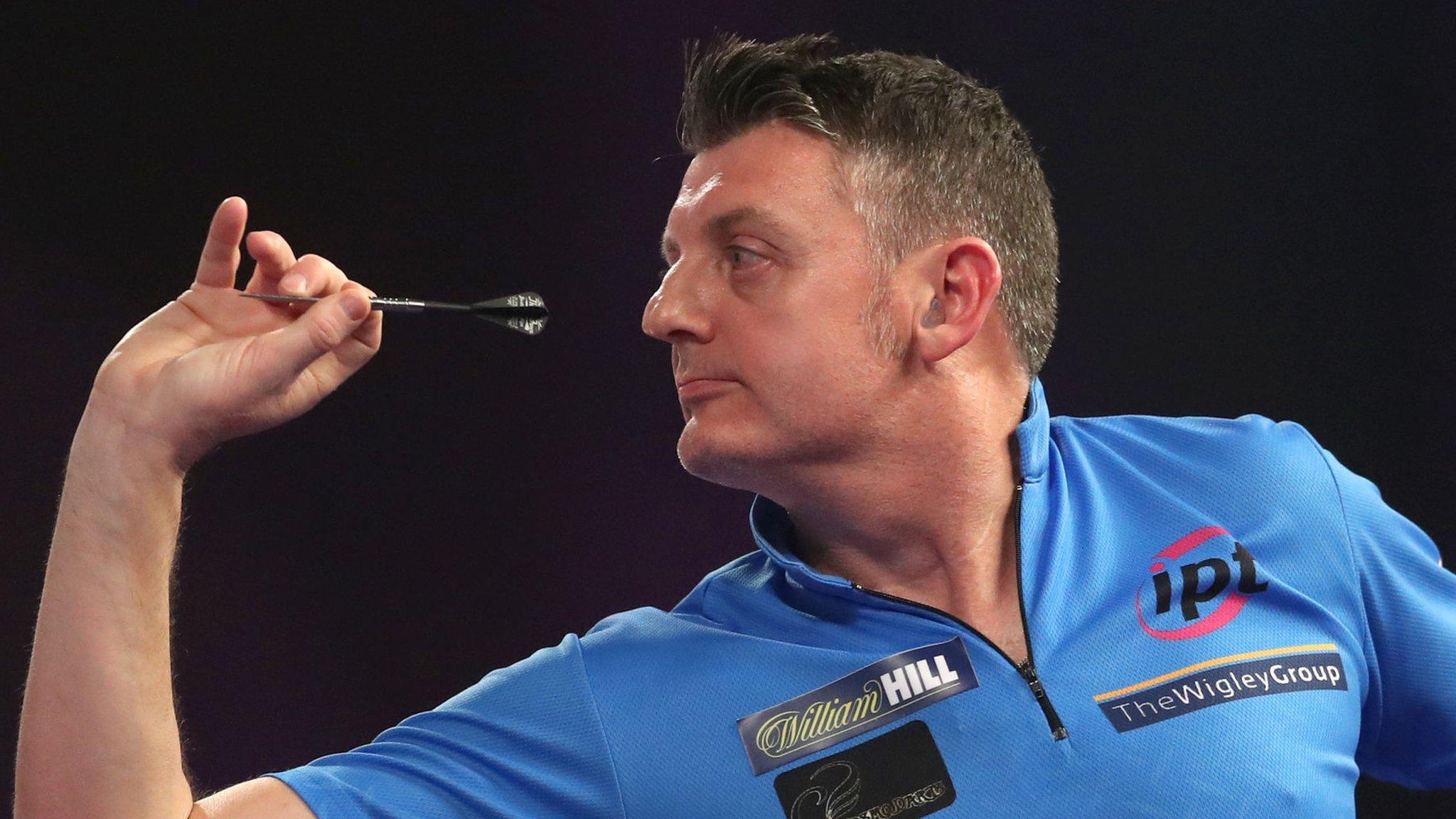 Justin Pipe throws a dart during victory over Bernie Smith at the PDC World Championship