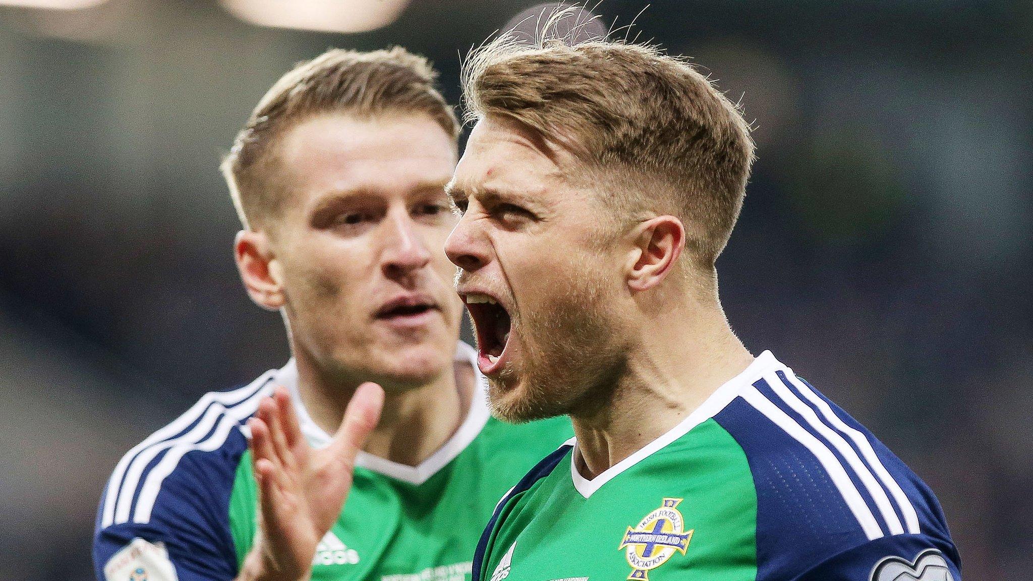 Jamie Ward celebrates after putting Northern Ireland ahead against Norway as he is about to be congratulated by Steven Davis