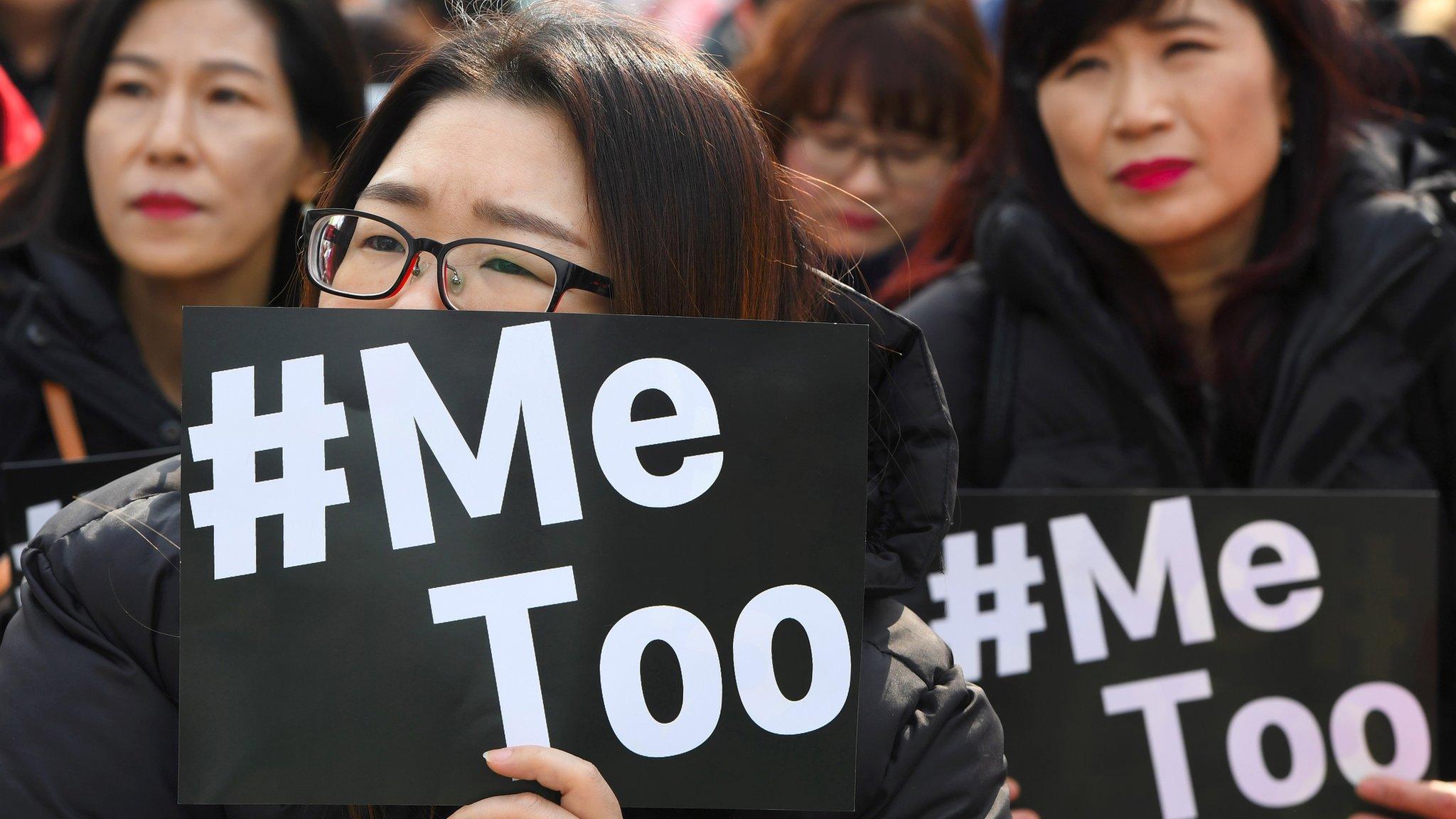 South Korean demonstrators hold banners during a rally to mark International Women's Day as part of the country's #MeToo movement in Seoul on March 8, 2018