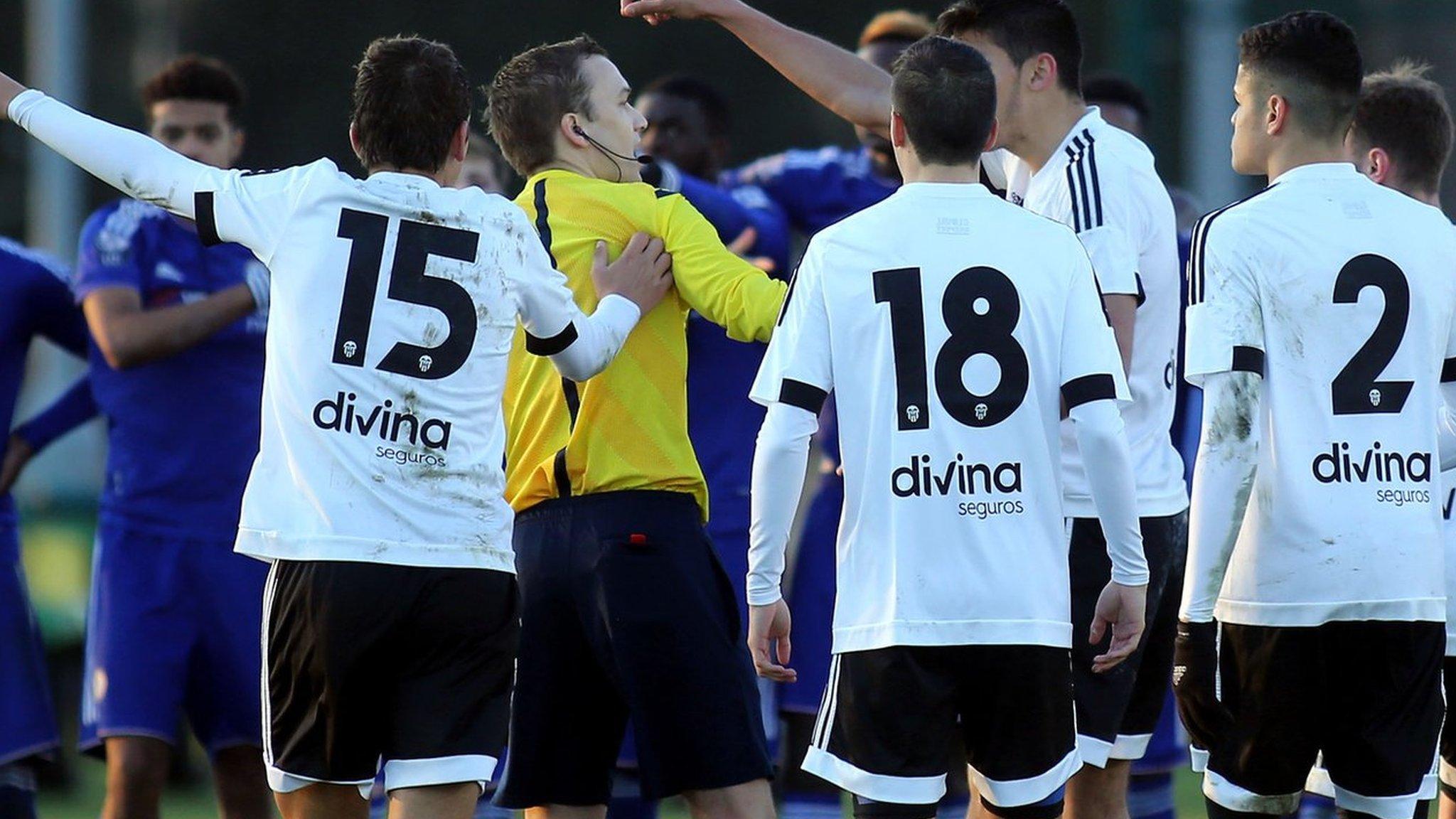 Valencia players protest to referee