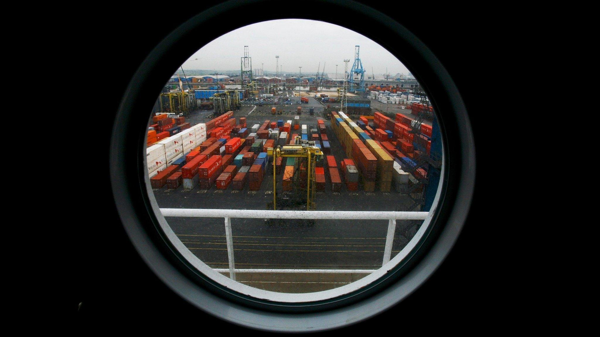 Ship freight containers sit on Tilbury Dock