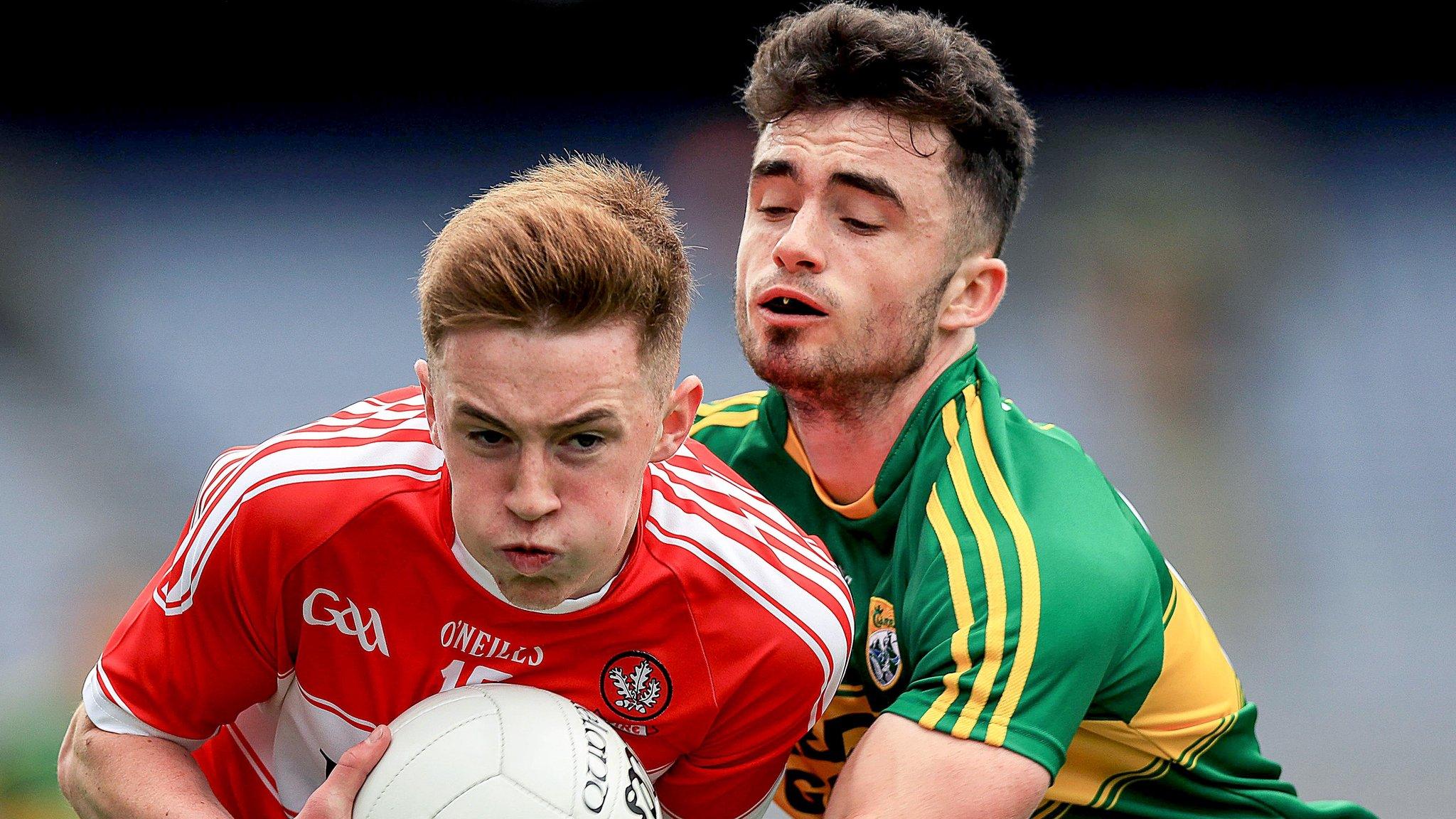 Kerry's David Naughton tackles Derry's Eoghan Bradley