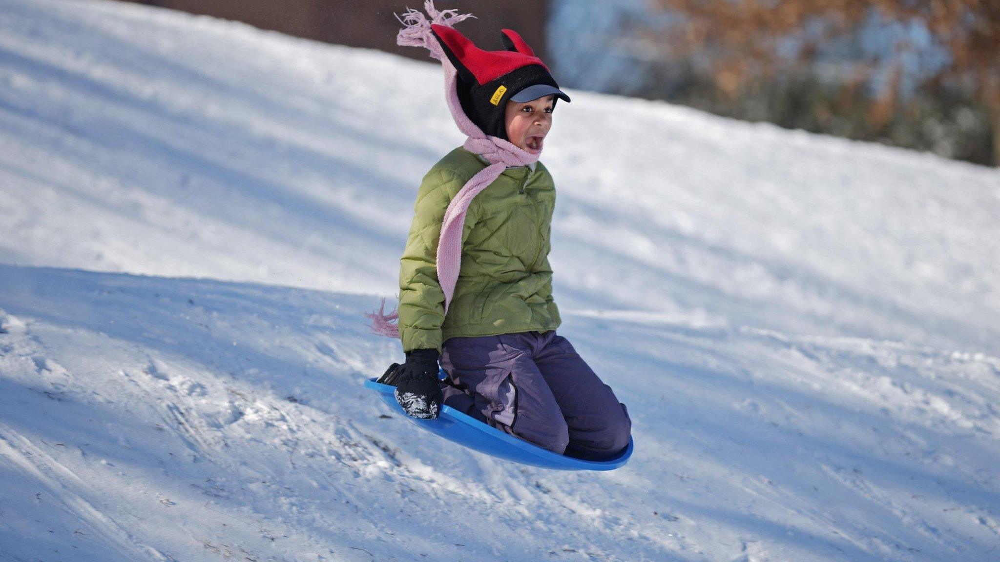 Girl sledging