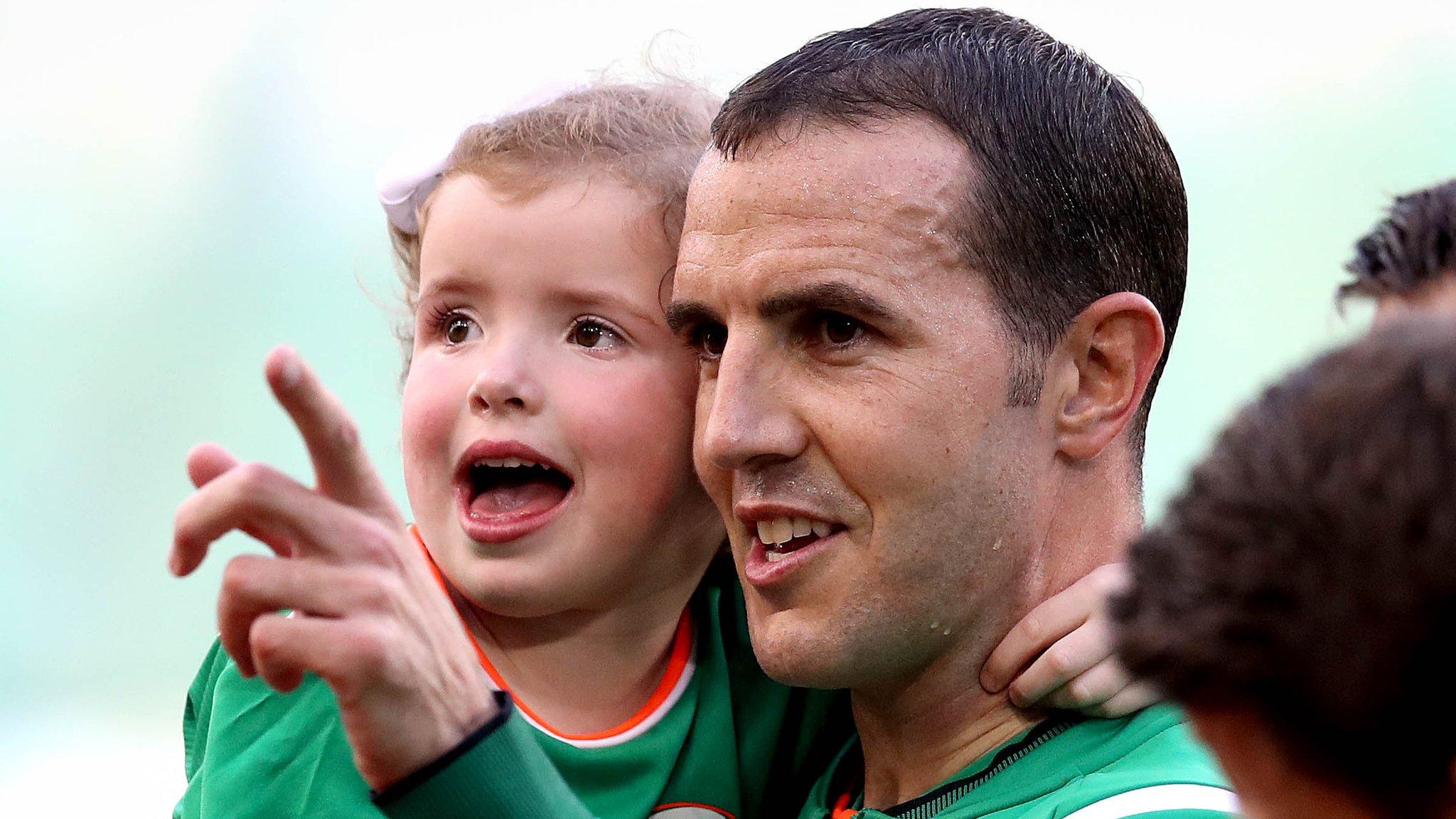 John O'Shea with his daughter Ruby as he prepared to win his 118th and final Republic of Ireland cap