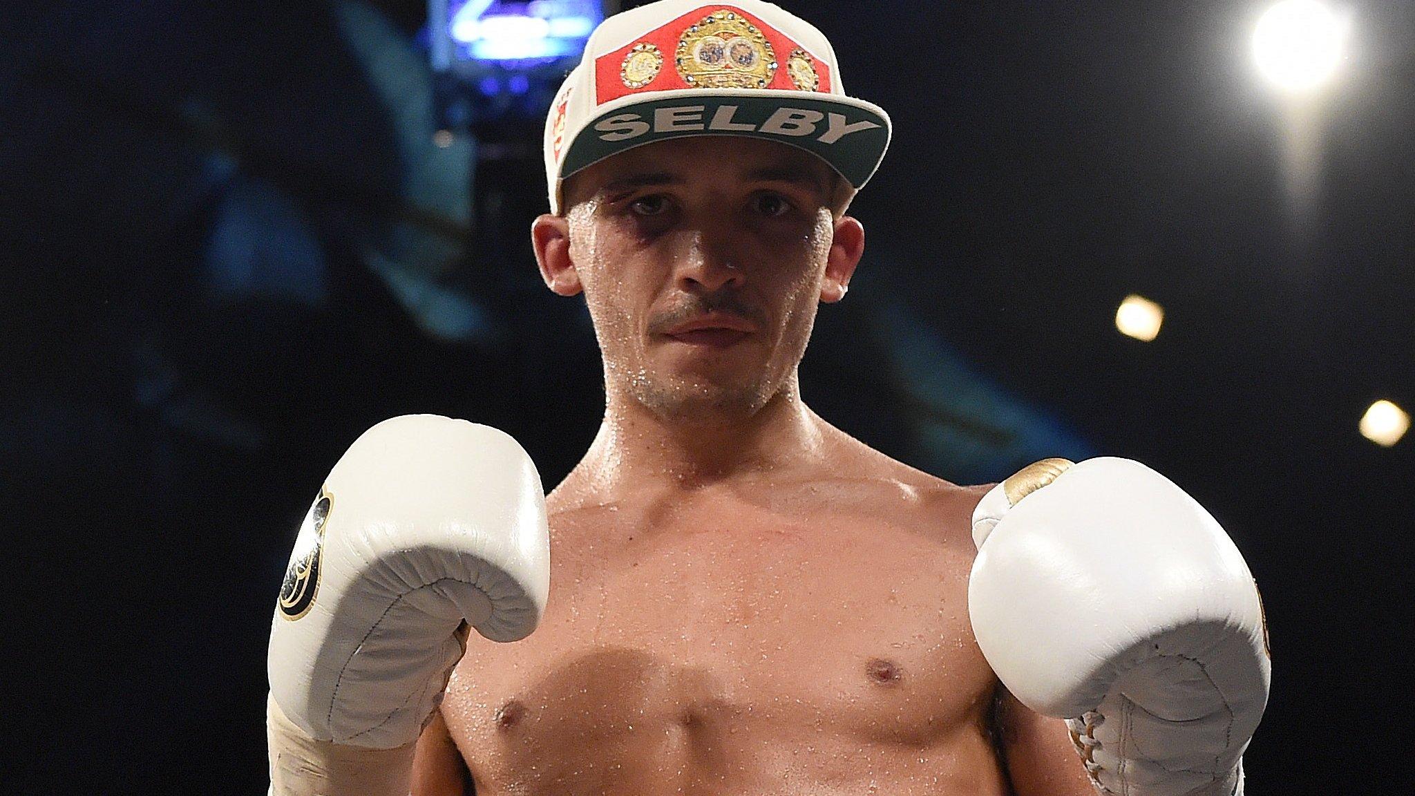 Lee Selby poses for the camera wearing a baseball cap bearing his surname