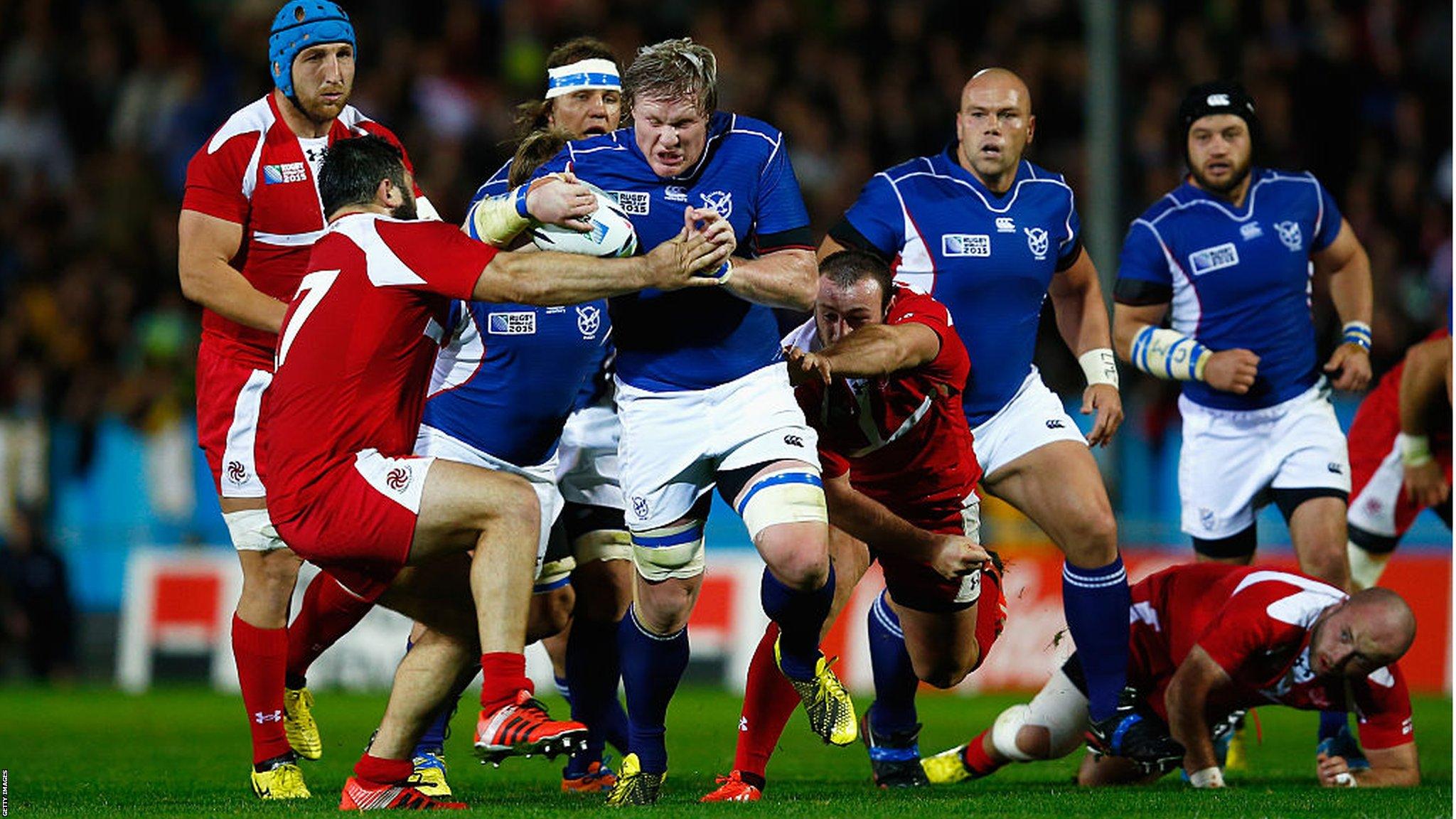 Renaldo Bothma of Namibia is wrapped up in the Georgia defense during the 2015 Rugby World Cup Pool C match between Namibia and Georgia