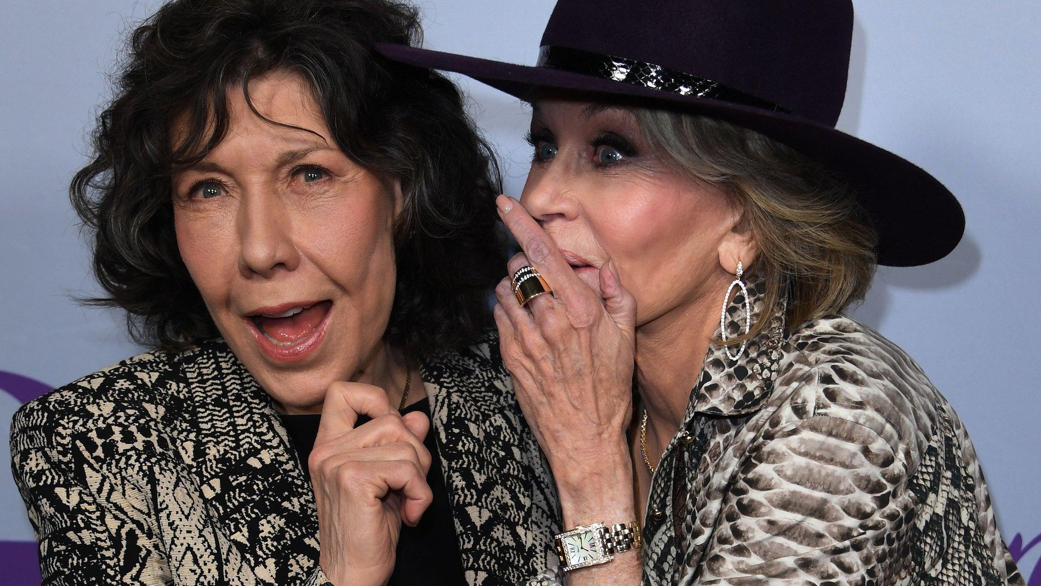 Actresses Lily Tomlin (L) and Jane Fonda (R) arrive for the Season 4 premiere of Netflix's 'Grace and Frankie' at the Arclight Theater in Culver City, California on January 18, 2018