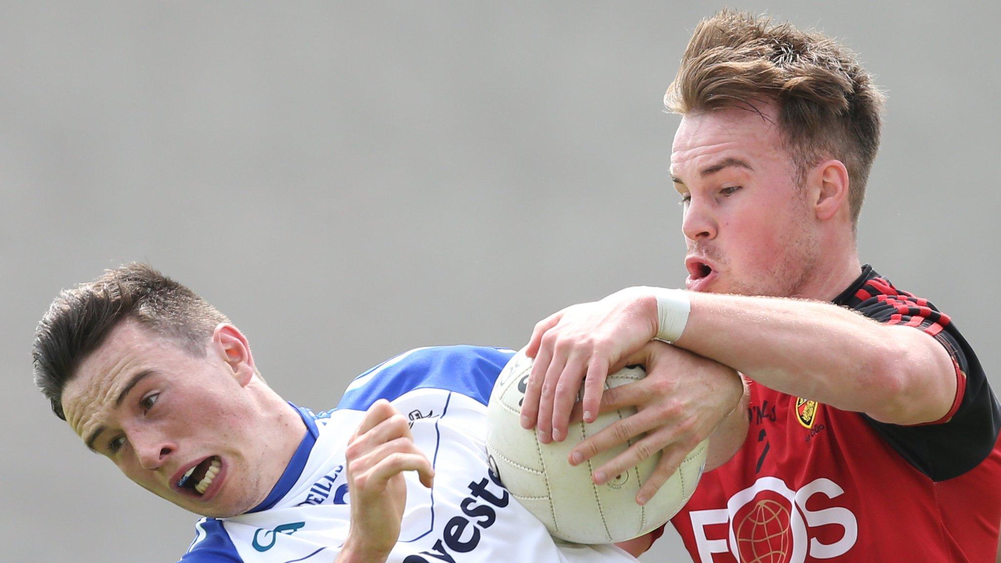 Monaghan's Shane Carey is tackled by Down's Darragh O'Hanlon