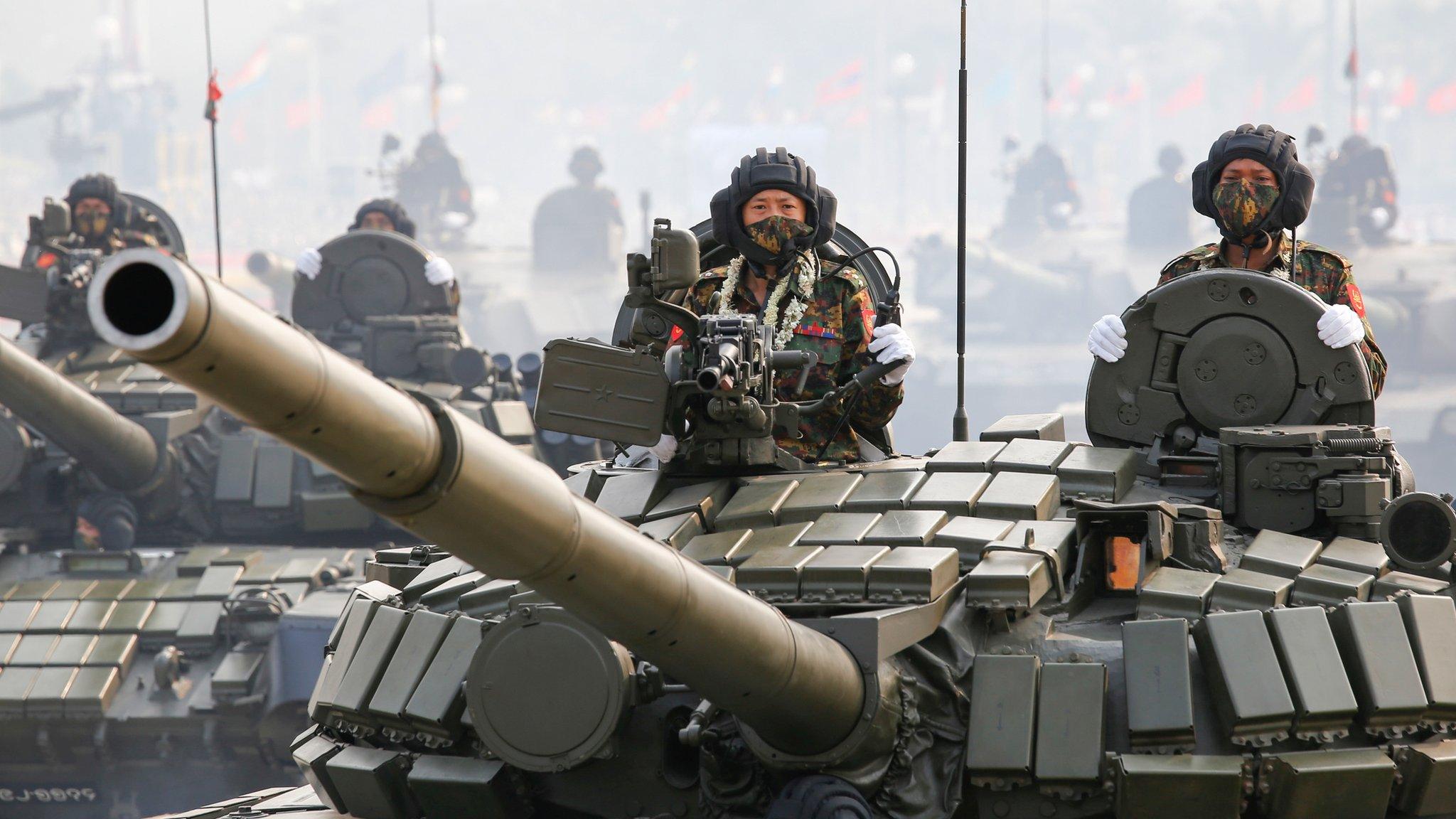 Military personnel in tanks participates in a parade on Armed Forces Day in Naypyitaw, Myanmar, March 27, 2021