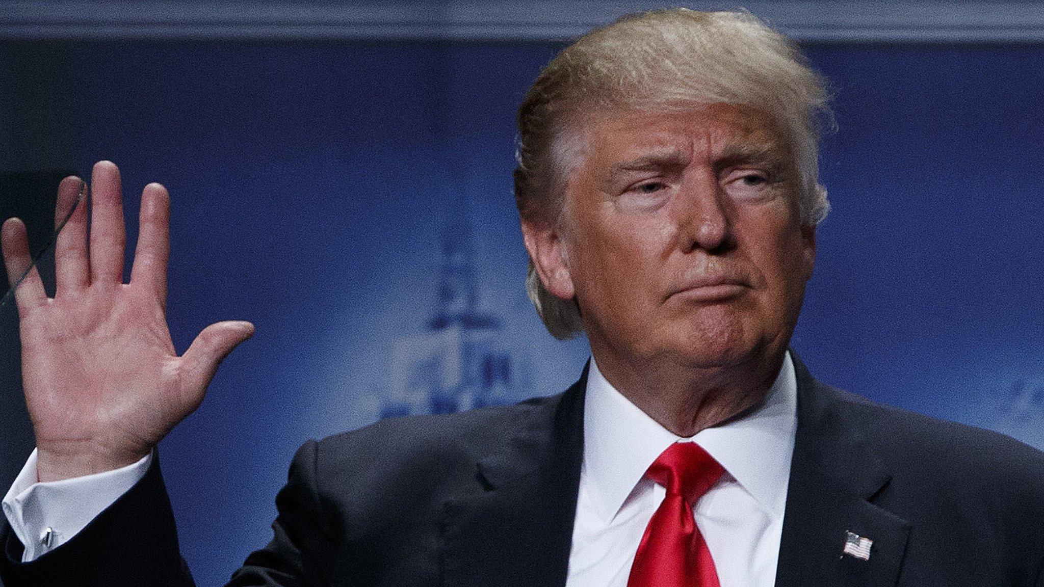 Republican presidential candidate Donald Trump waves after delivering economic policy speech to Detroit Economic Club, Monday, Aug. 8, 2016